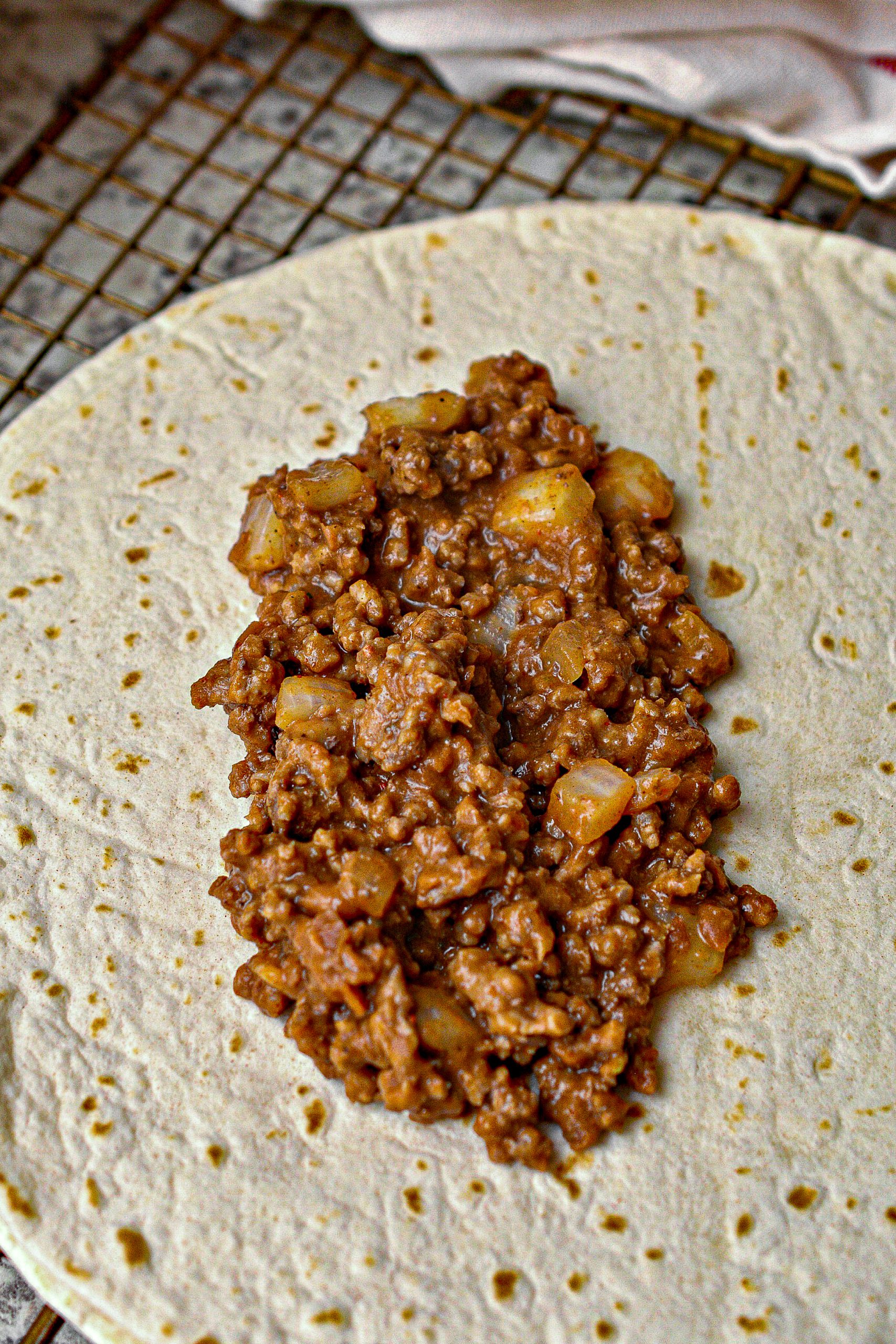 Put an even amount of filling into the center of the 10 tortillas.