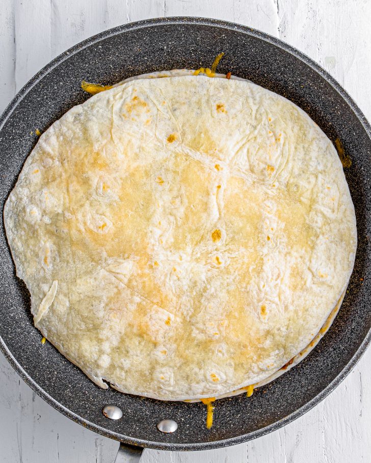 Place an additional flour tortilla on top.