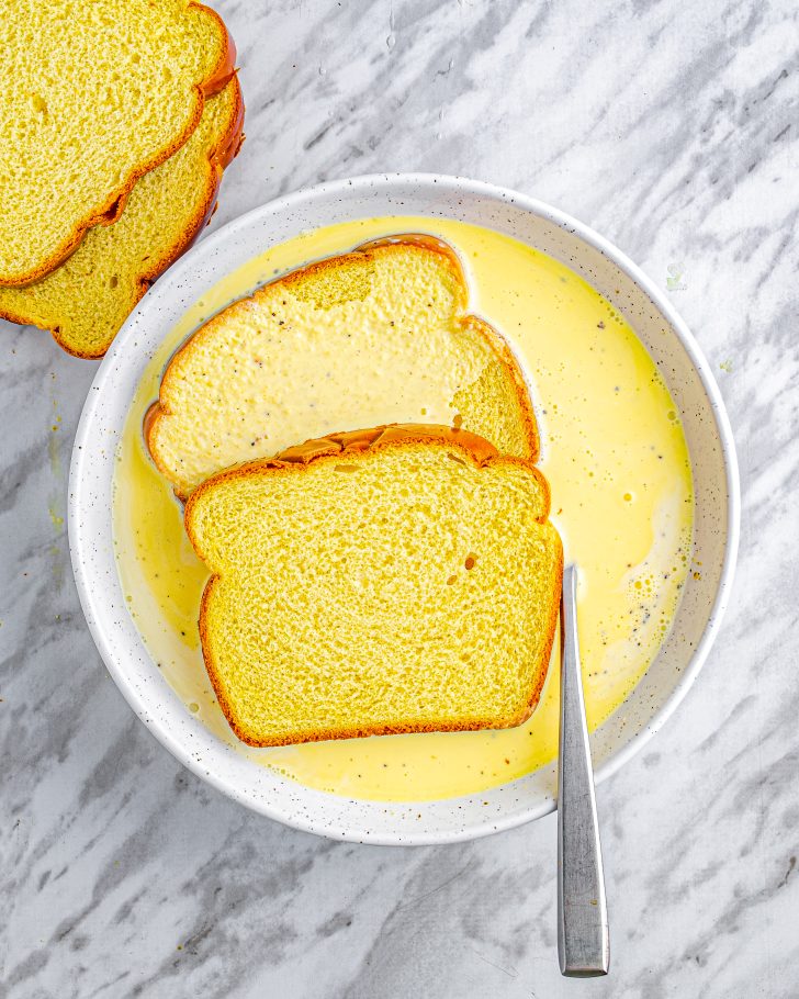 Dip the slices of bread into the egg mixture.