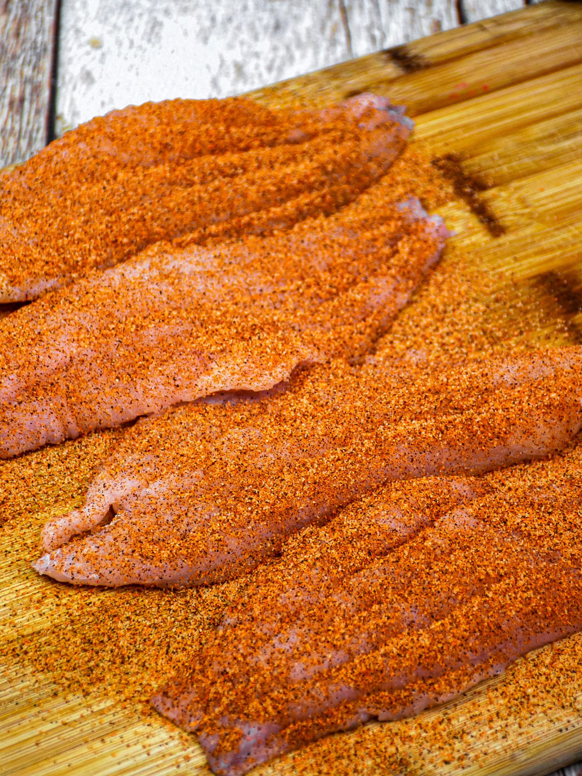 Brush 1 tbsp. Melted butter onto the fish and then evenly sprinkle the cajun spice on all sides of the fish.