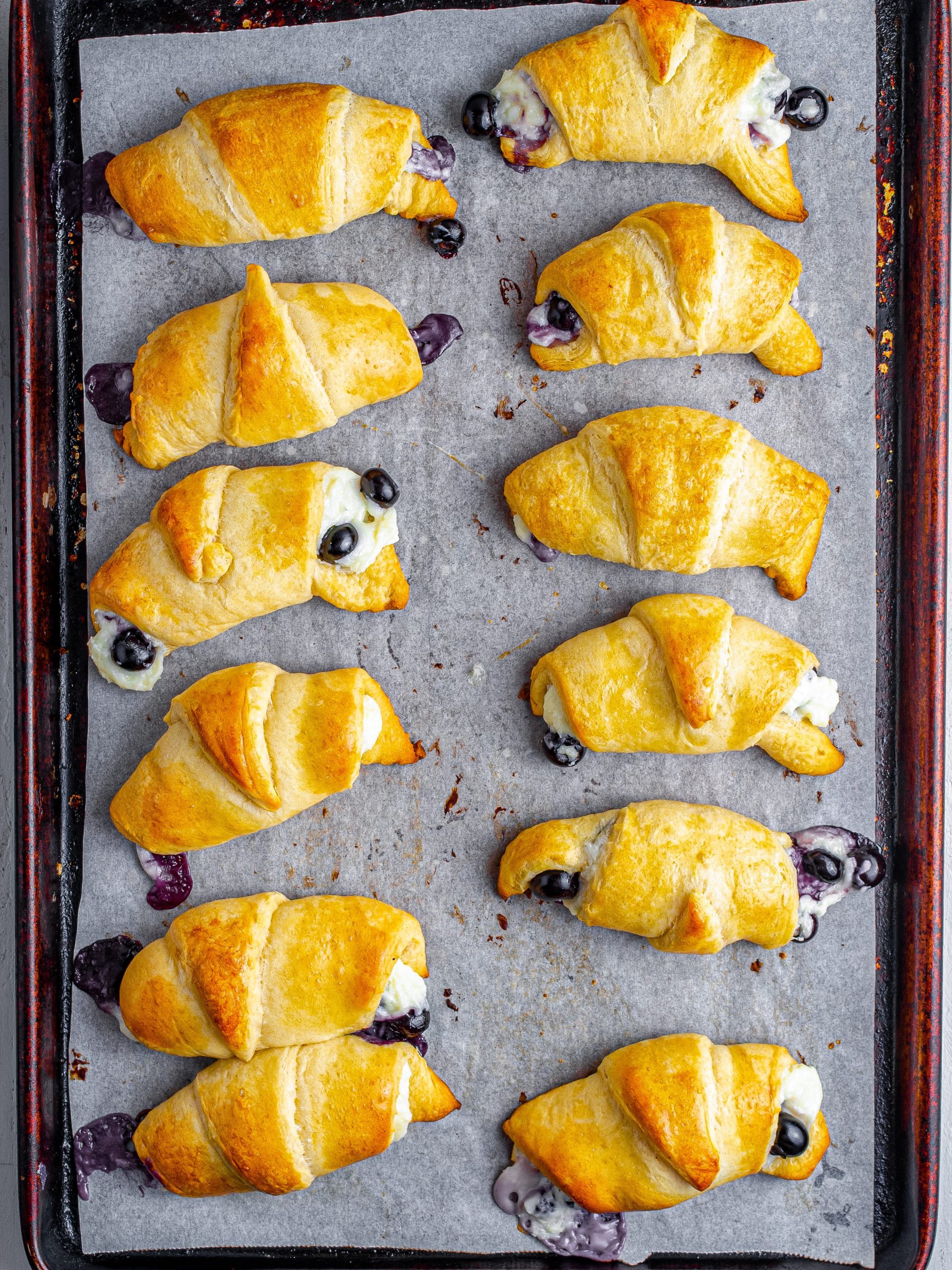https://sweetpeaskitchen.com/wp-content/uploads/2023/03/Blueberry-Cheesecake-Crescent-Rolls-Step-7-to-8-edited-scaled.jpg