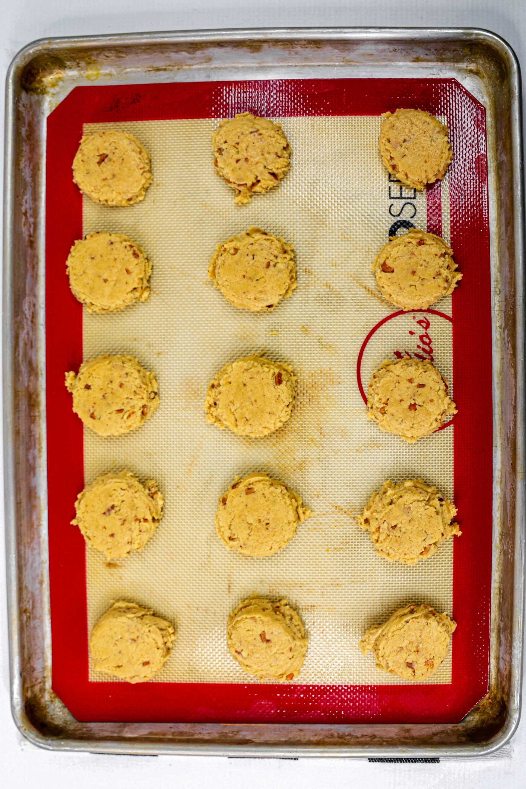 Using a small cookie scoop, scoop dough out onto the cookie sheets. Bake until golden brown, about 10 to 15 minutes.