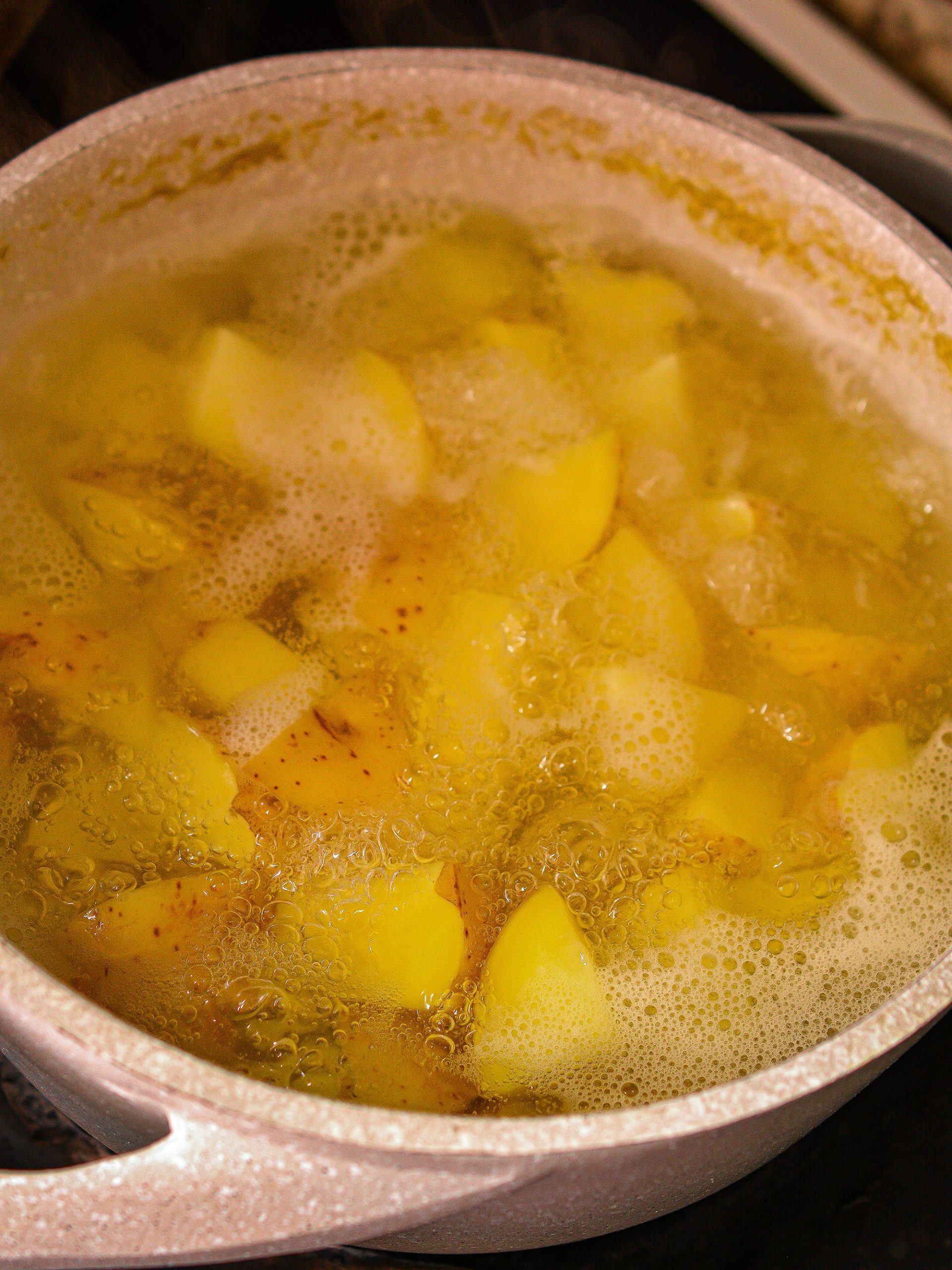 Start by boiling the potatoes.