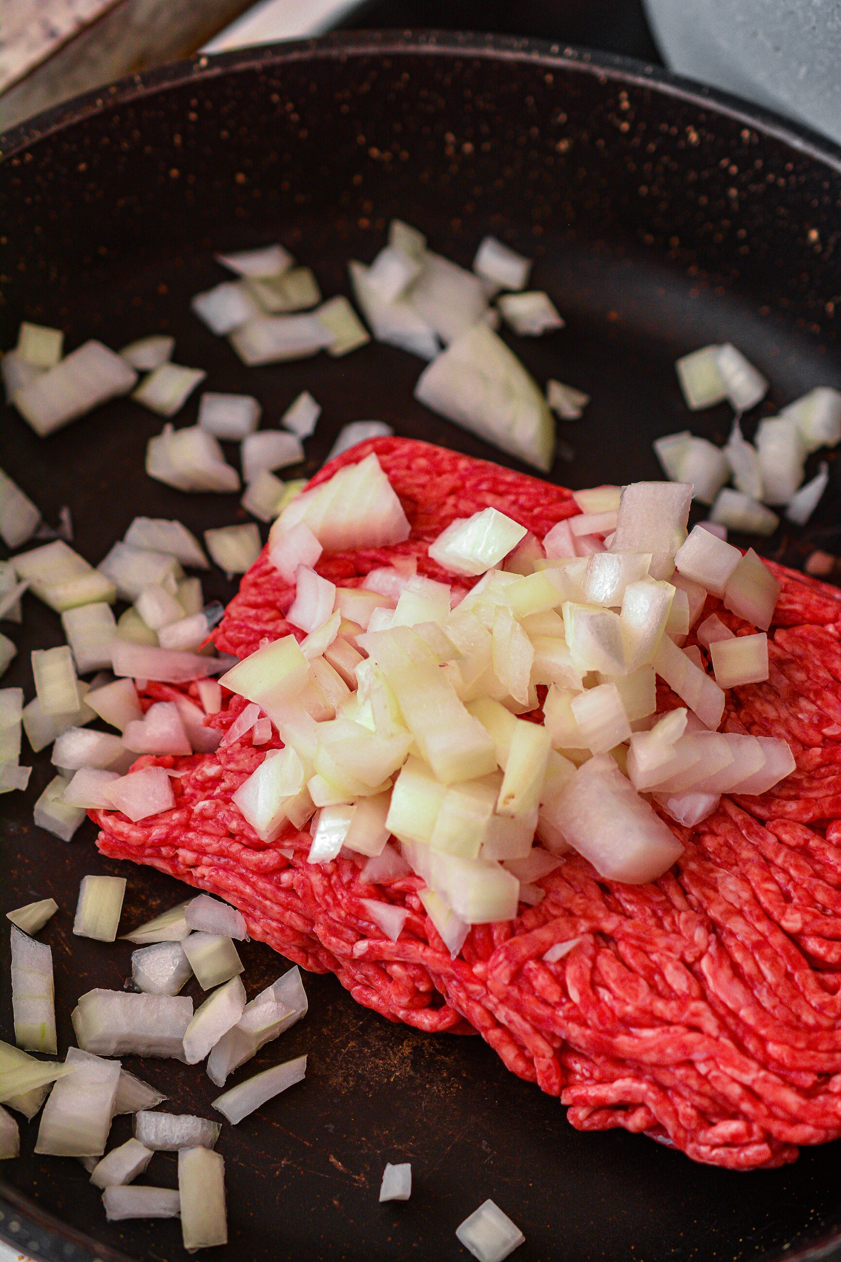 While the fries are cooking, cook the ground beef and onion over medium-high heat on the stove.