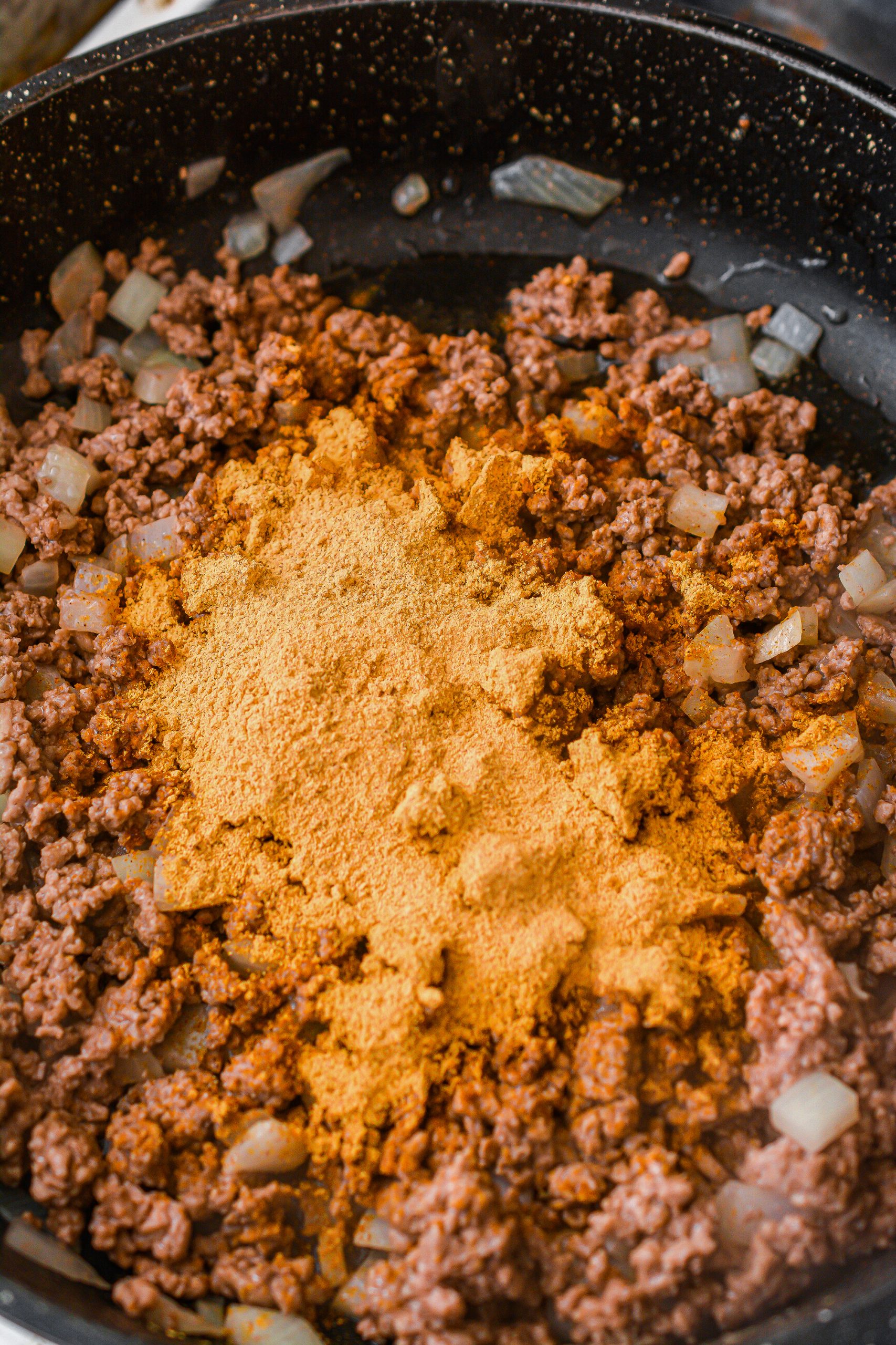  Lower the heat to low, and stir in the taco seasoning. Saute another few minutes, stirring to combine. 