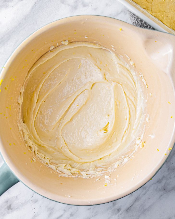 Combine the cream cheese, vanilla, lemon juice, lemon zest, and ½ cup of sugar in a mixing bowl until smooth.