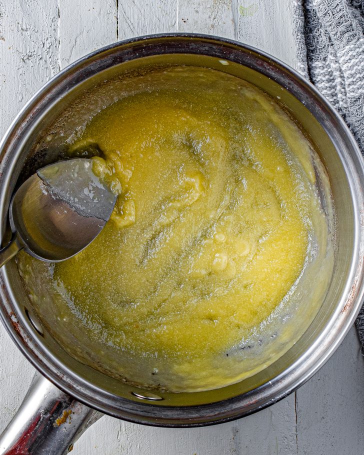 Add the flour to the butter, and whisk to combine well, cooking for a minute or two until the raw flour taste has been cooked off.