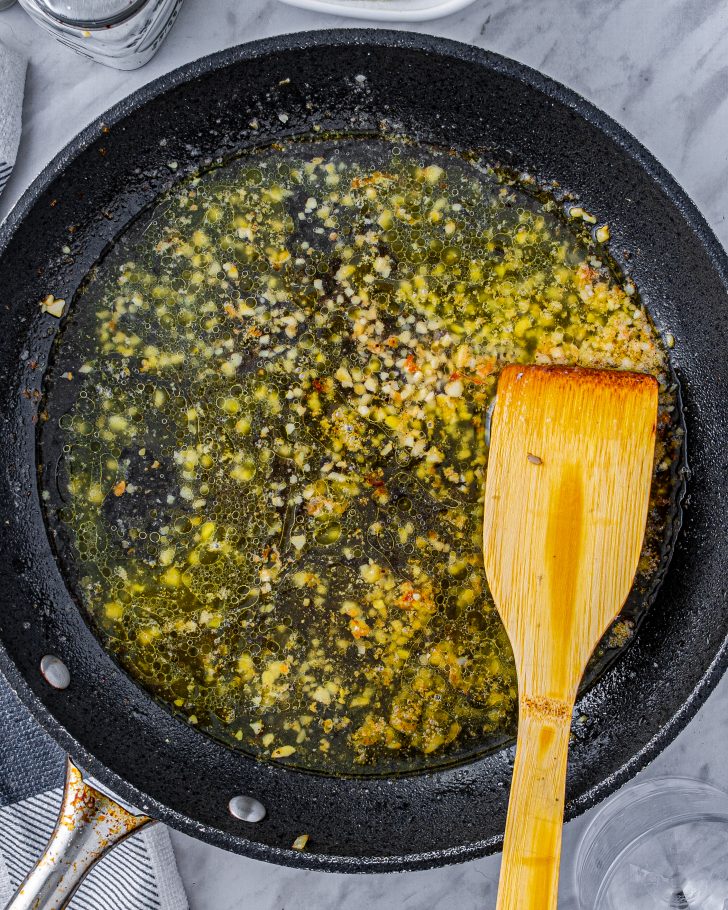Stir the white cooking wine into the skillet