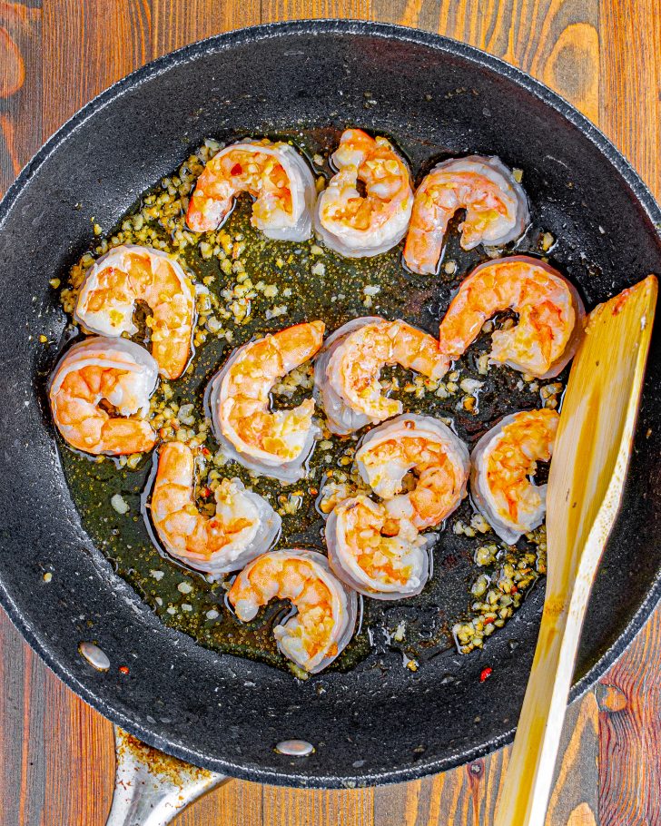 Place the shrimp into the skillet along with ¼ tsp salt and saute until the shrimp are cooked through.