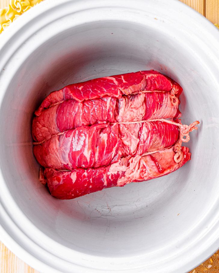 Add your roast to the slow cooker.