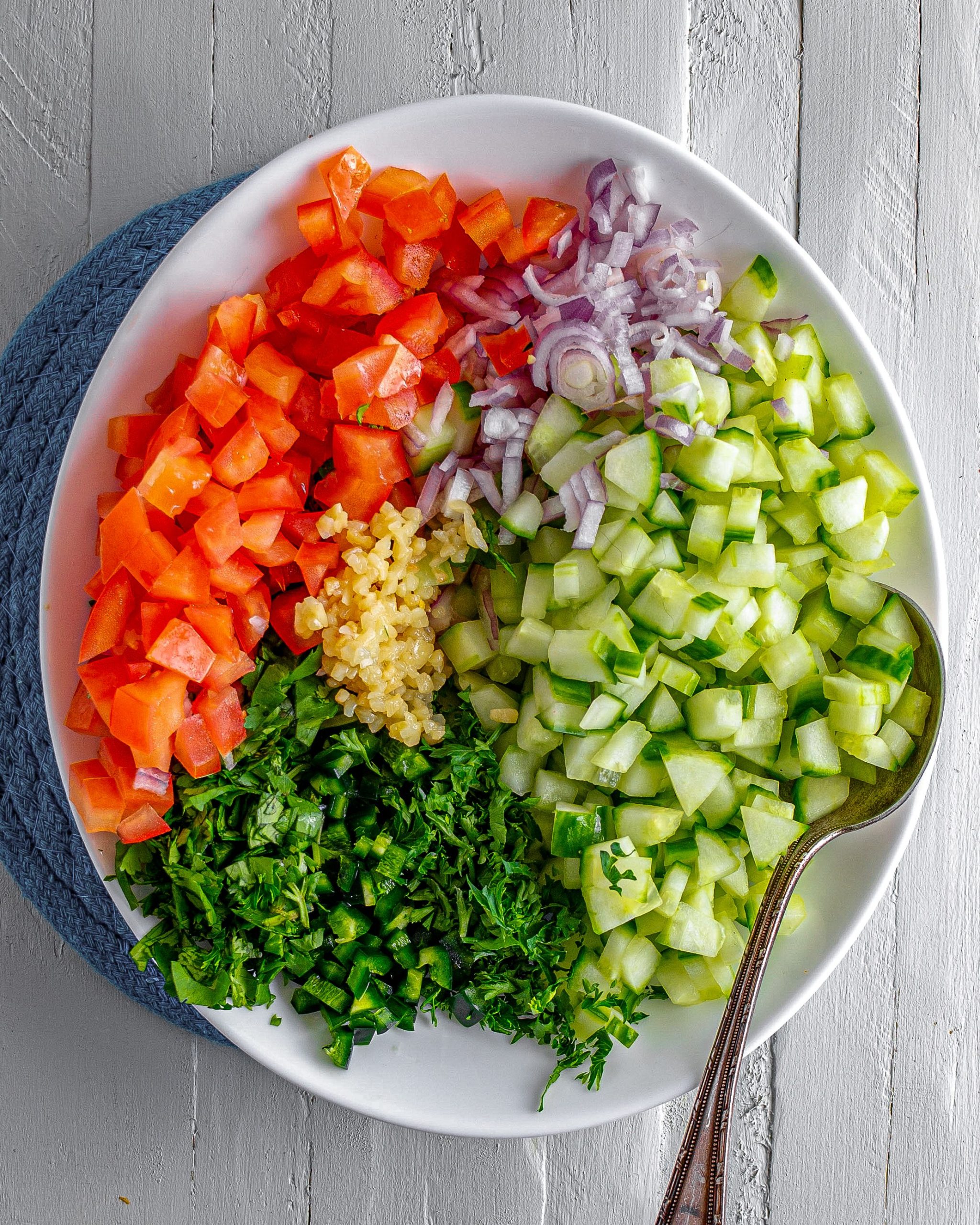 In a larger mixing bowl, mix together the ingredients for the salsa. 