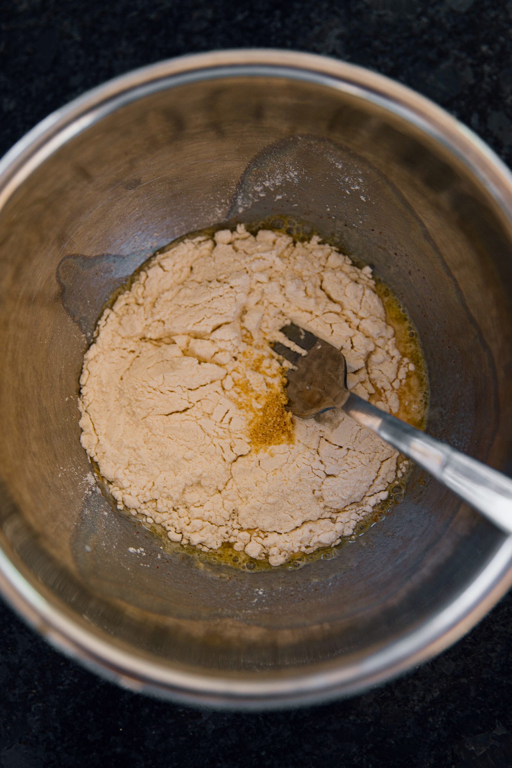 In a bag or bowl, add flour cornstarch, and seasonings.