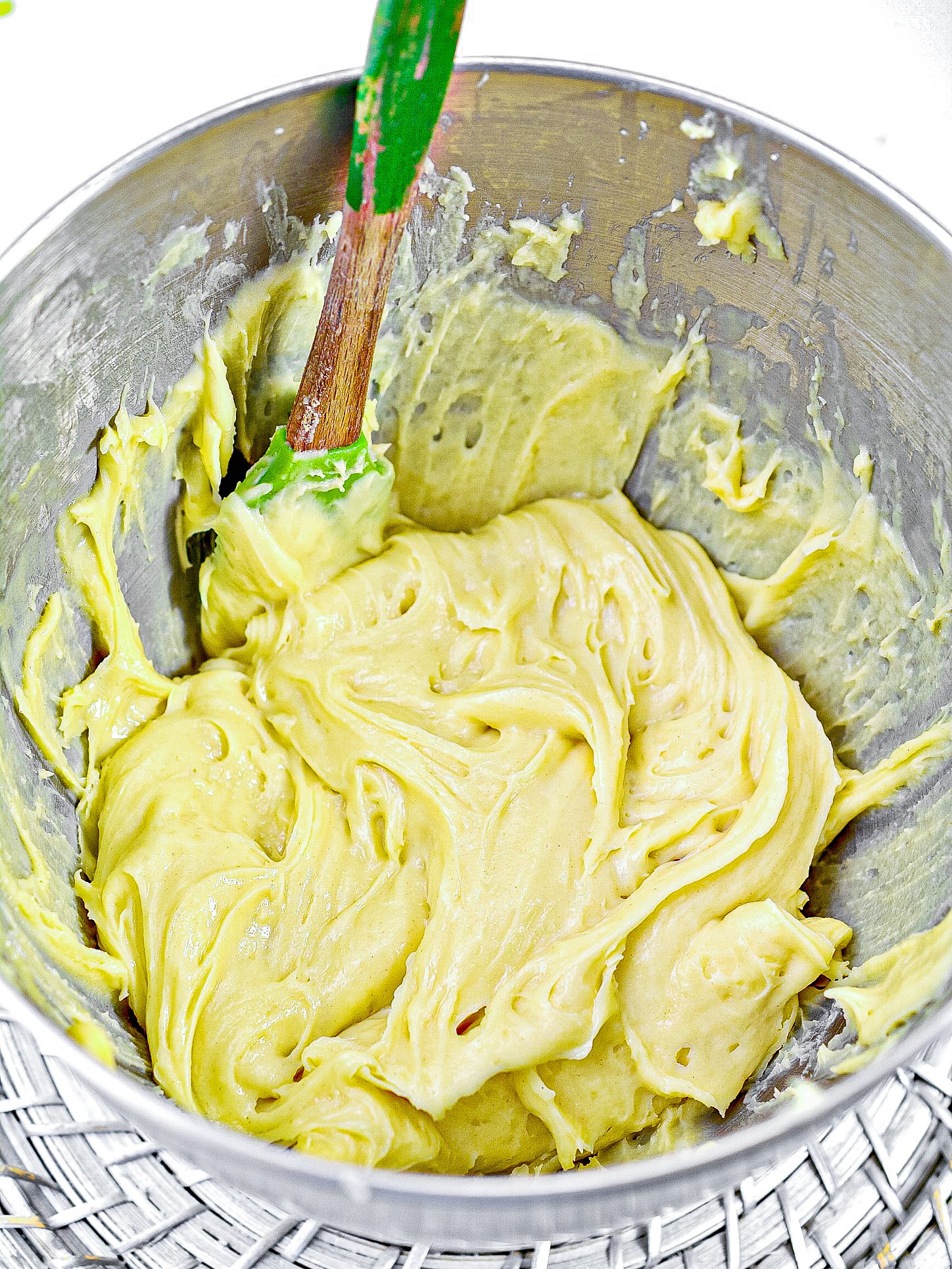 Mix the eggs into the dough one at a time. Be sure each egg is completely combined before adding another.