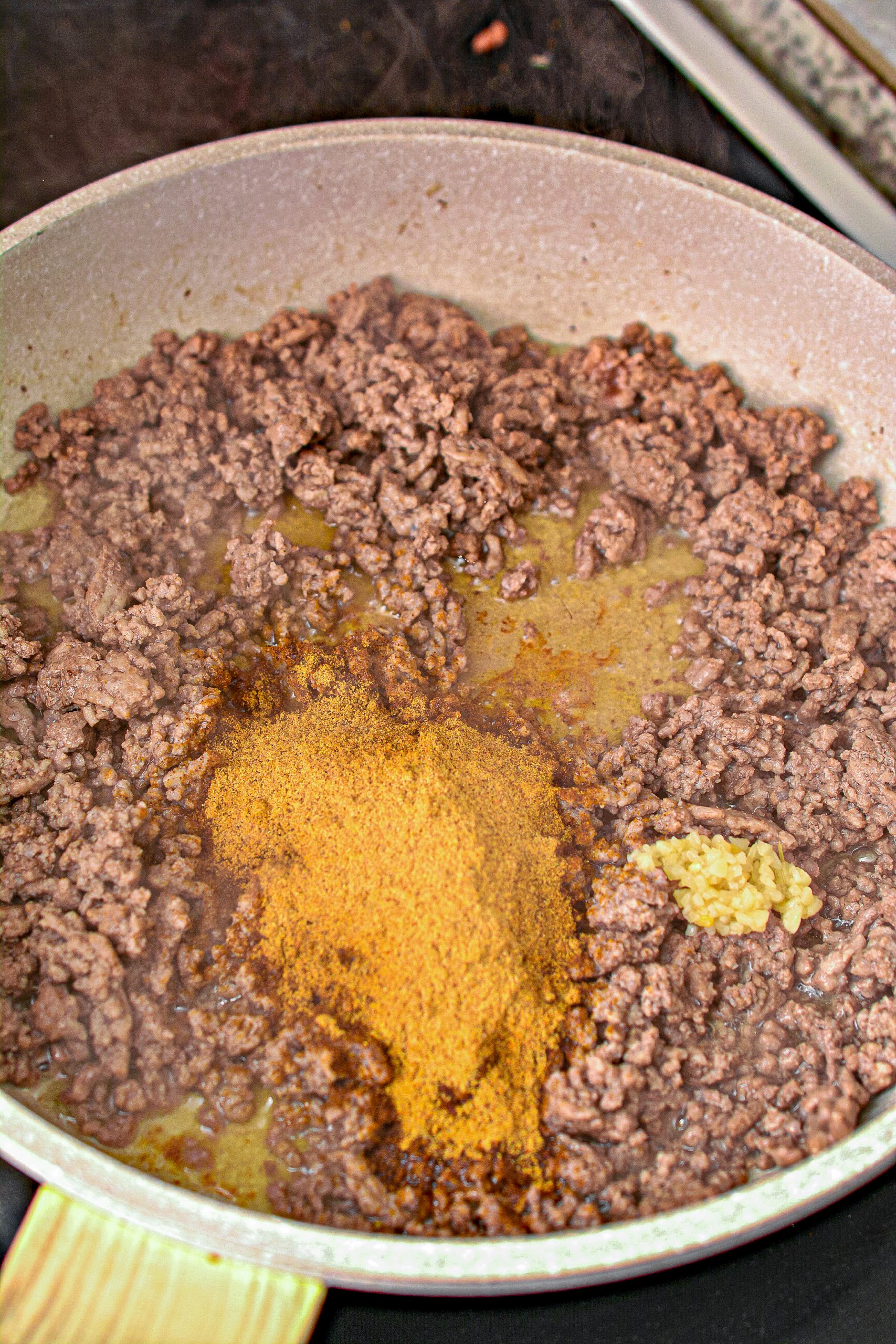 Place the ground beef in a skillet over medium-high heat on the stove, and cook until completely browned.