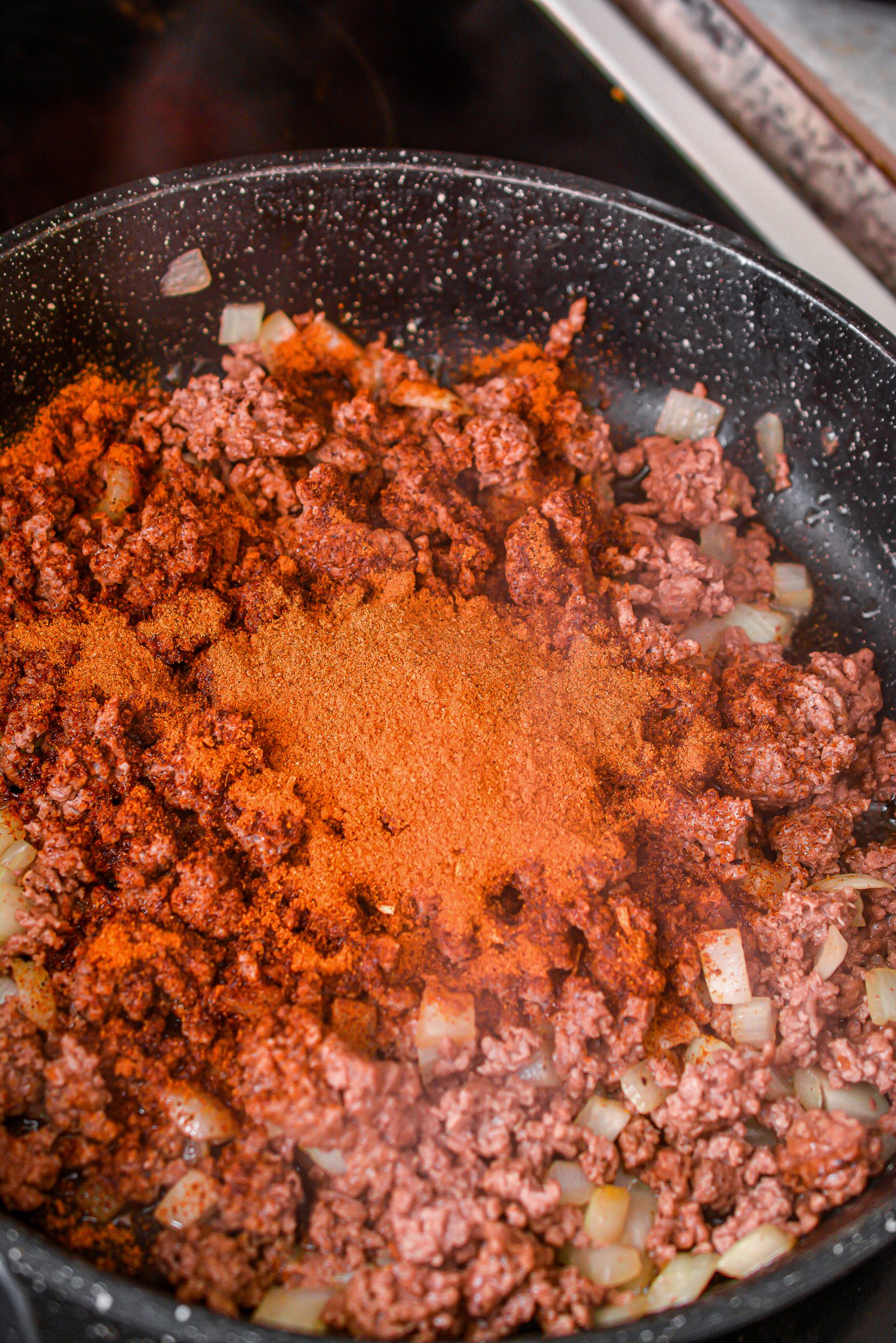 Reduce the heat to low and stir in the taco seasoning. Saute for a few minutes longer.