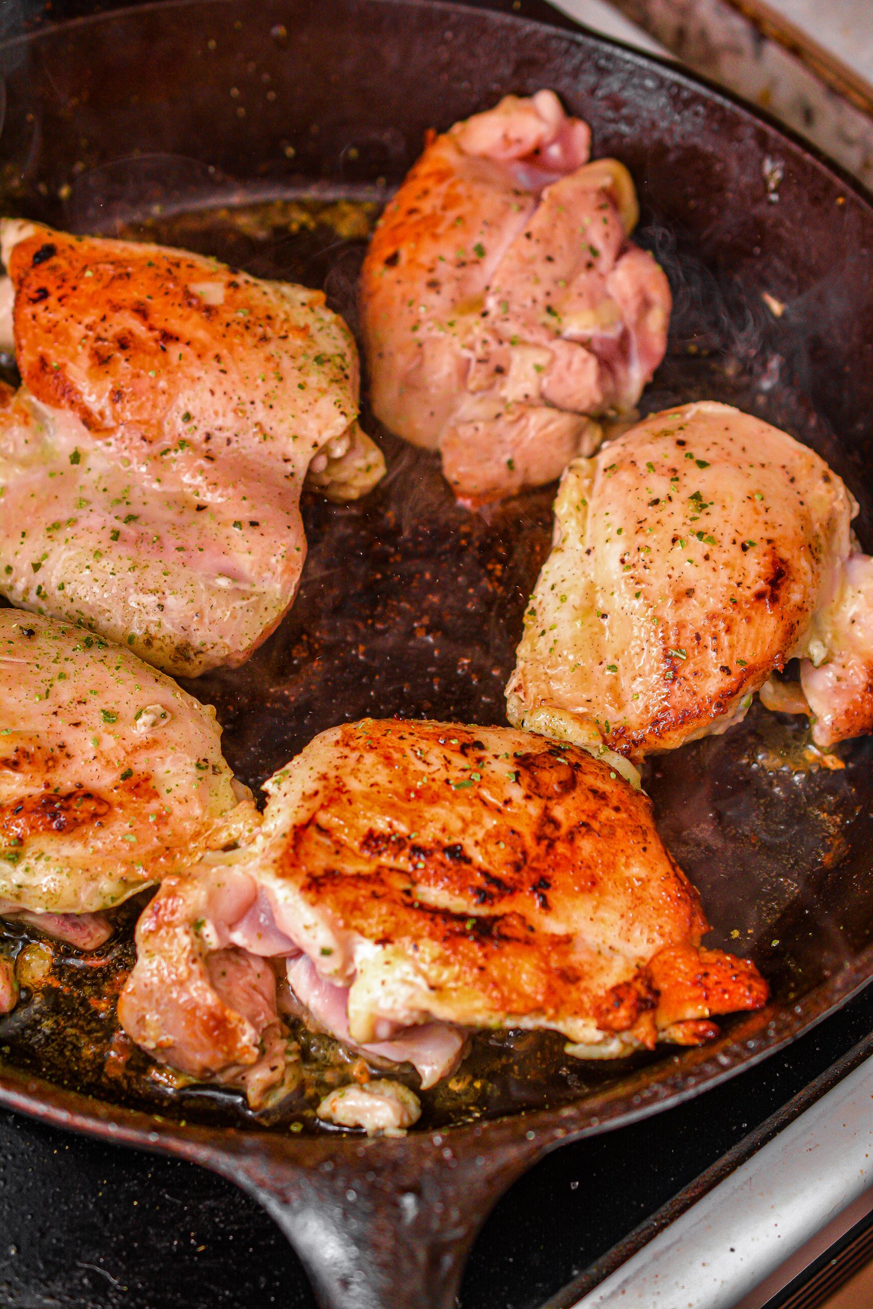 Season the chicken with salt and pepper to taste, the thyme and sage. Sear the chicken on both sides, browning it well and evenly. Remove the chicken and set aside.