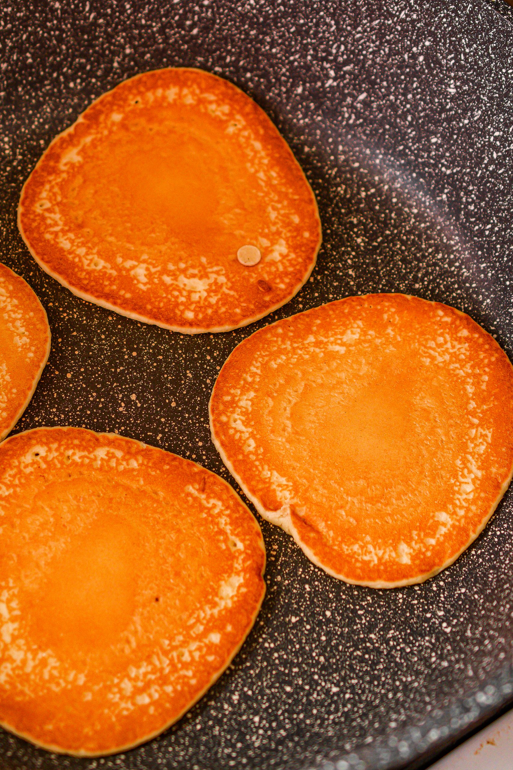 Prepare the pancake mix, and use it to make 8 smaller pancakes.