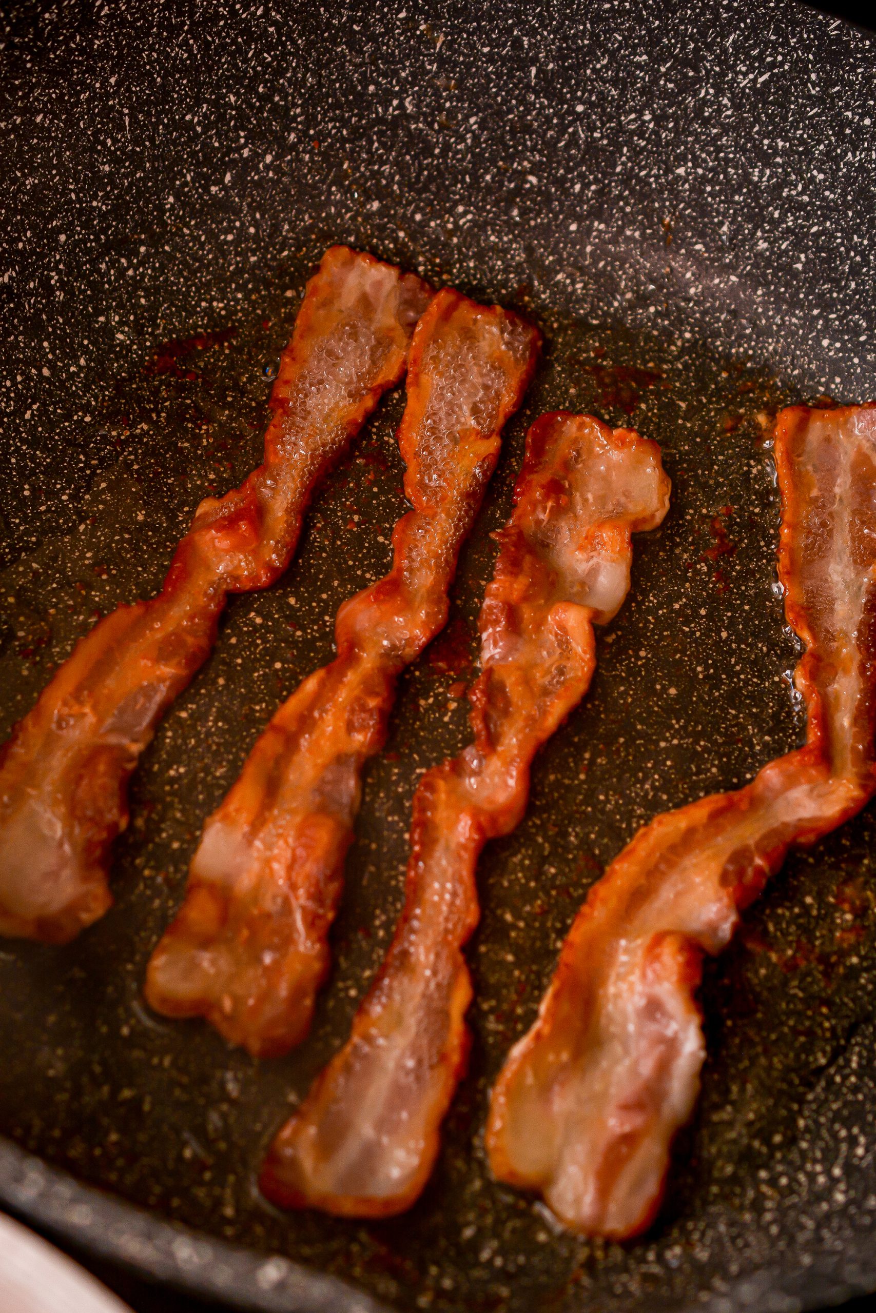Cook the bacon until crispy and then drain on a paper towel-lined plate.
