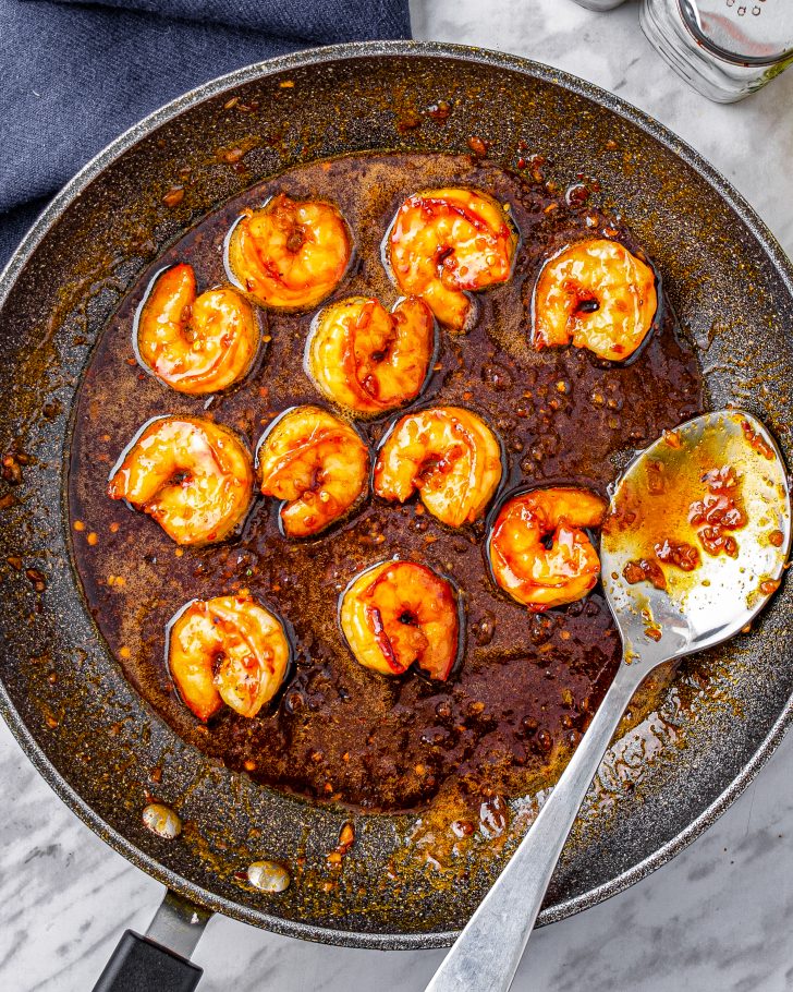 Pour the sauce over the shrimp, reduce the heat on the stove to medium and saute until the sauce thickens and becomes a bit sticky.