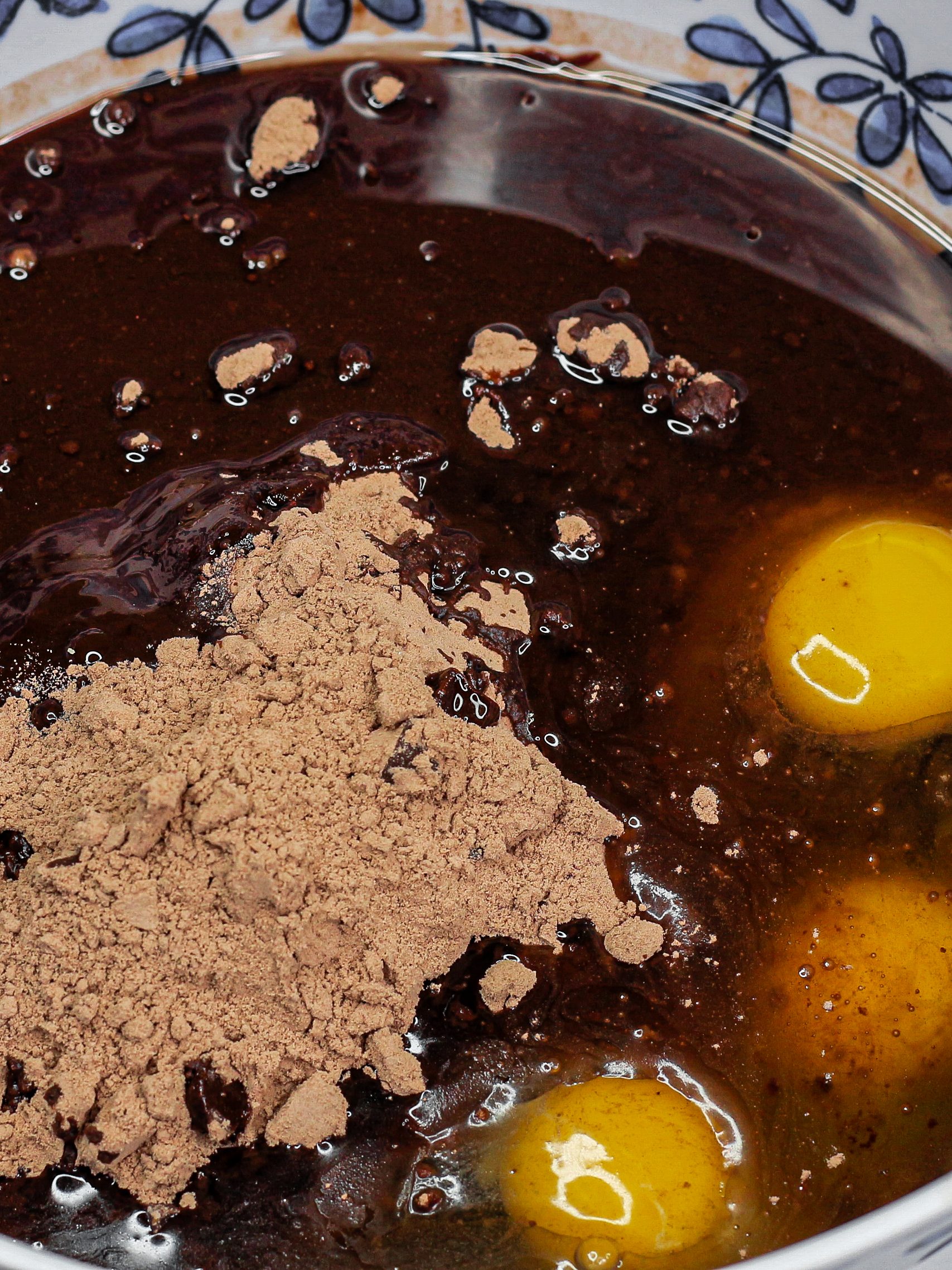 Using a large bowl, mix together the brownie mix, 1 jar of hot fudge sauce, 3 large eggs, and oil until combined.