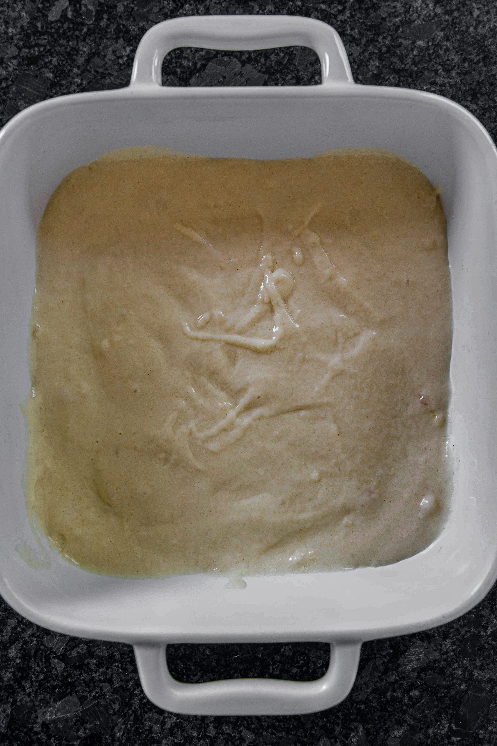 Pour the mixture into a medium baking dish. If you wish, you can cover the plate with non-stick paper, but don’t grease it.