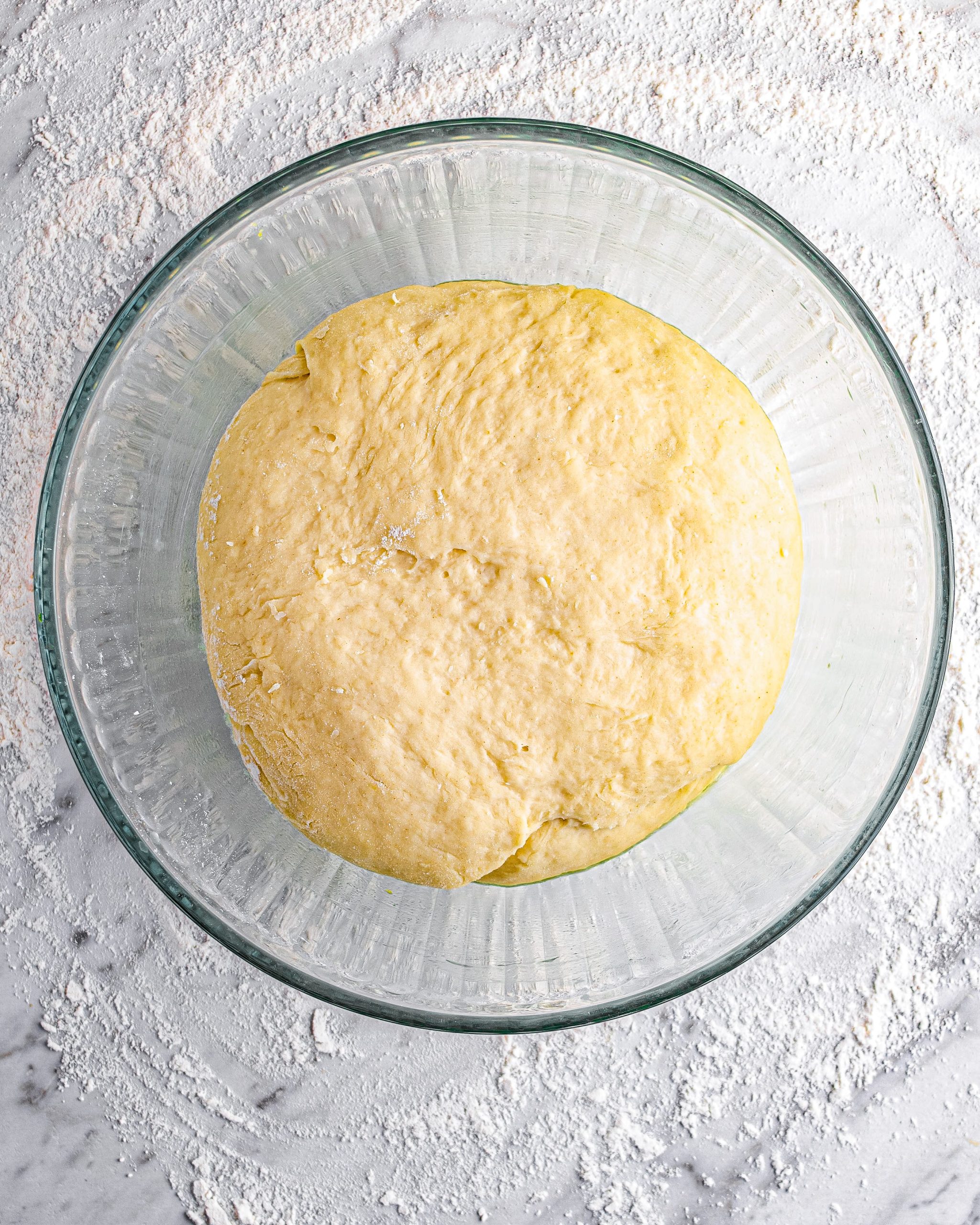 Put the dough into a bowl that has been greased, and cover. Allow the dough to rise in a warm area for an hour.