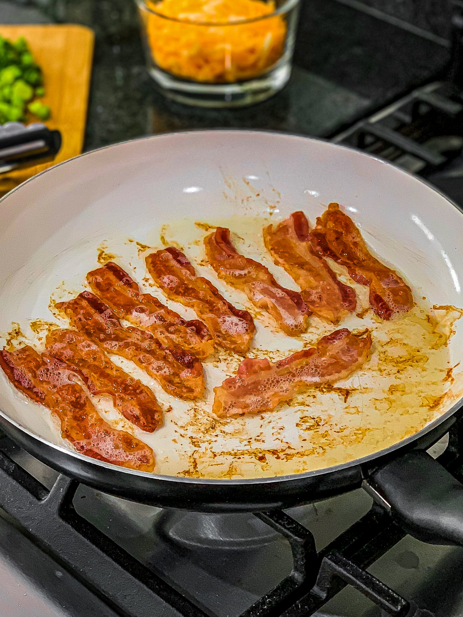 Fry bacon while the chicken and potatoes are in the oven.