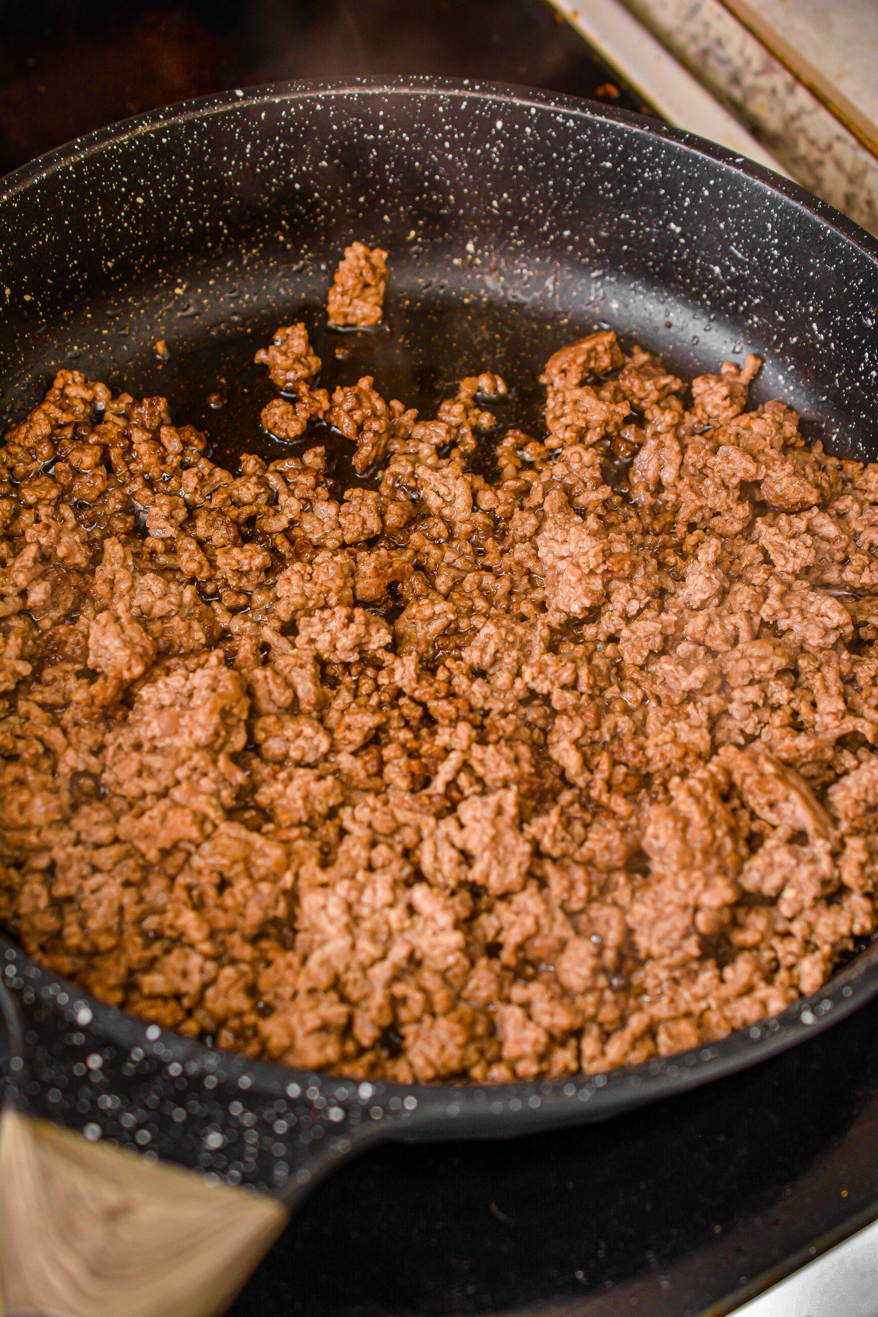 Heat the ground beef in a skillet over medium-high heat until browned completely through.