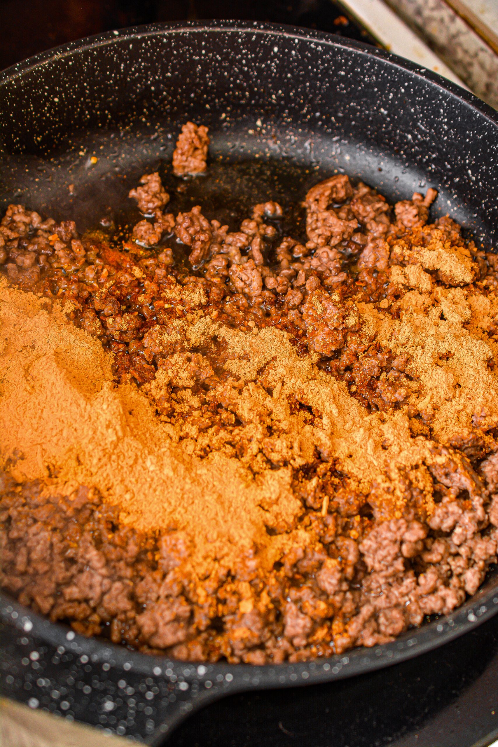 Reduce the heat in the skillet to medium and stir in the taco seasoning.
