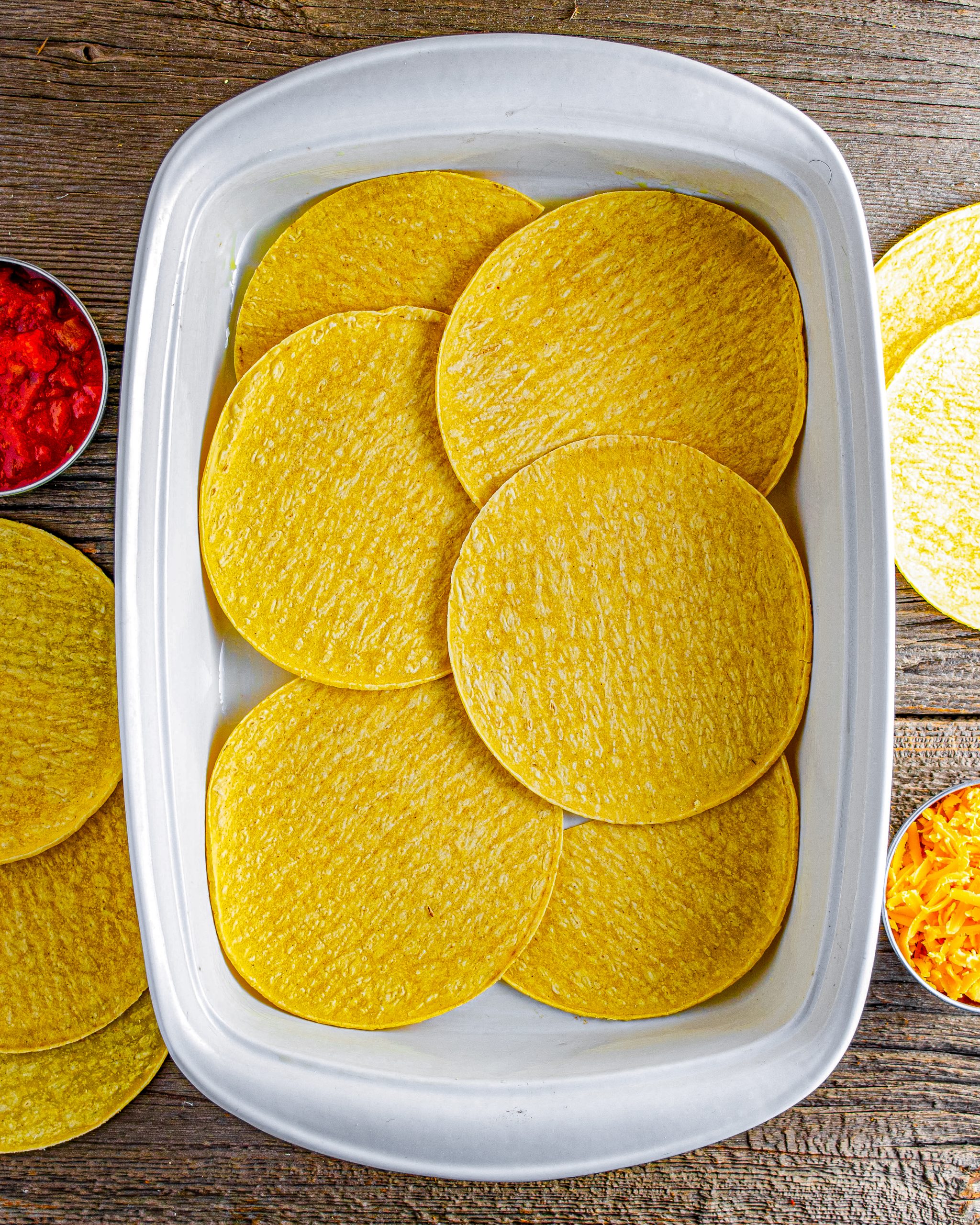 Line a 9x13-inch baking dish with half of your tortillas.