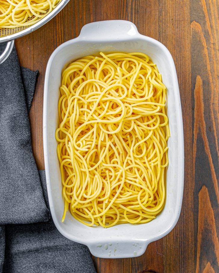 Add half the noodles to the baking dish.