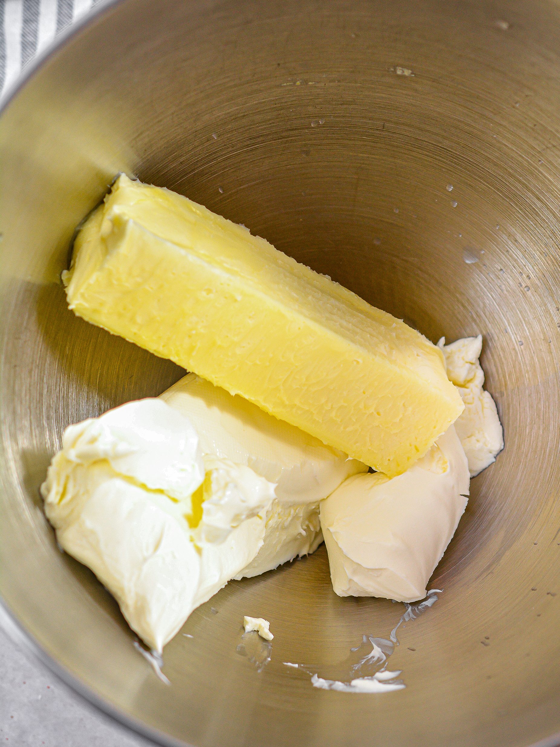 In a mixing bowl, add 8oz cream cheese softened and 1 stick of butter.