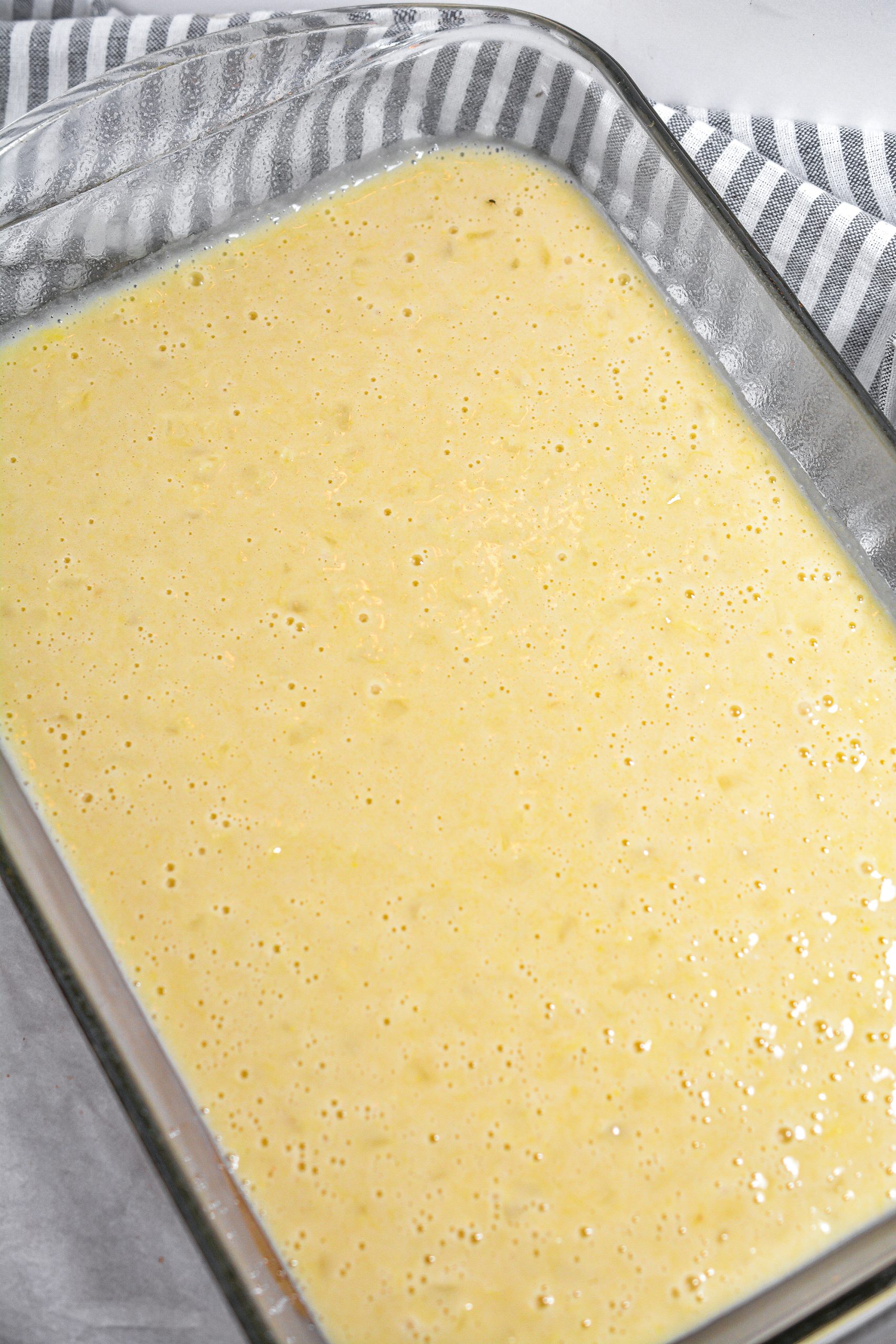 Pour the batter into a well-greased 9x13 baking dish.