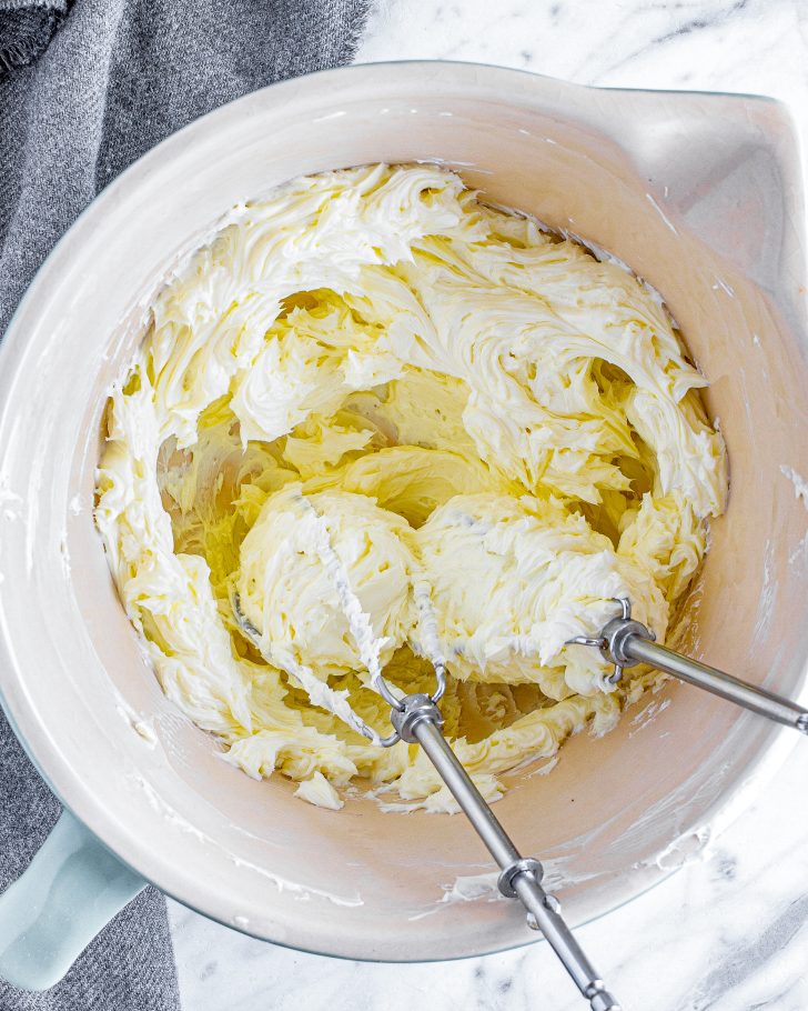 Place the cream cheese into a mixing bowl and blend until smooth. 