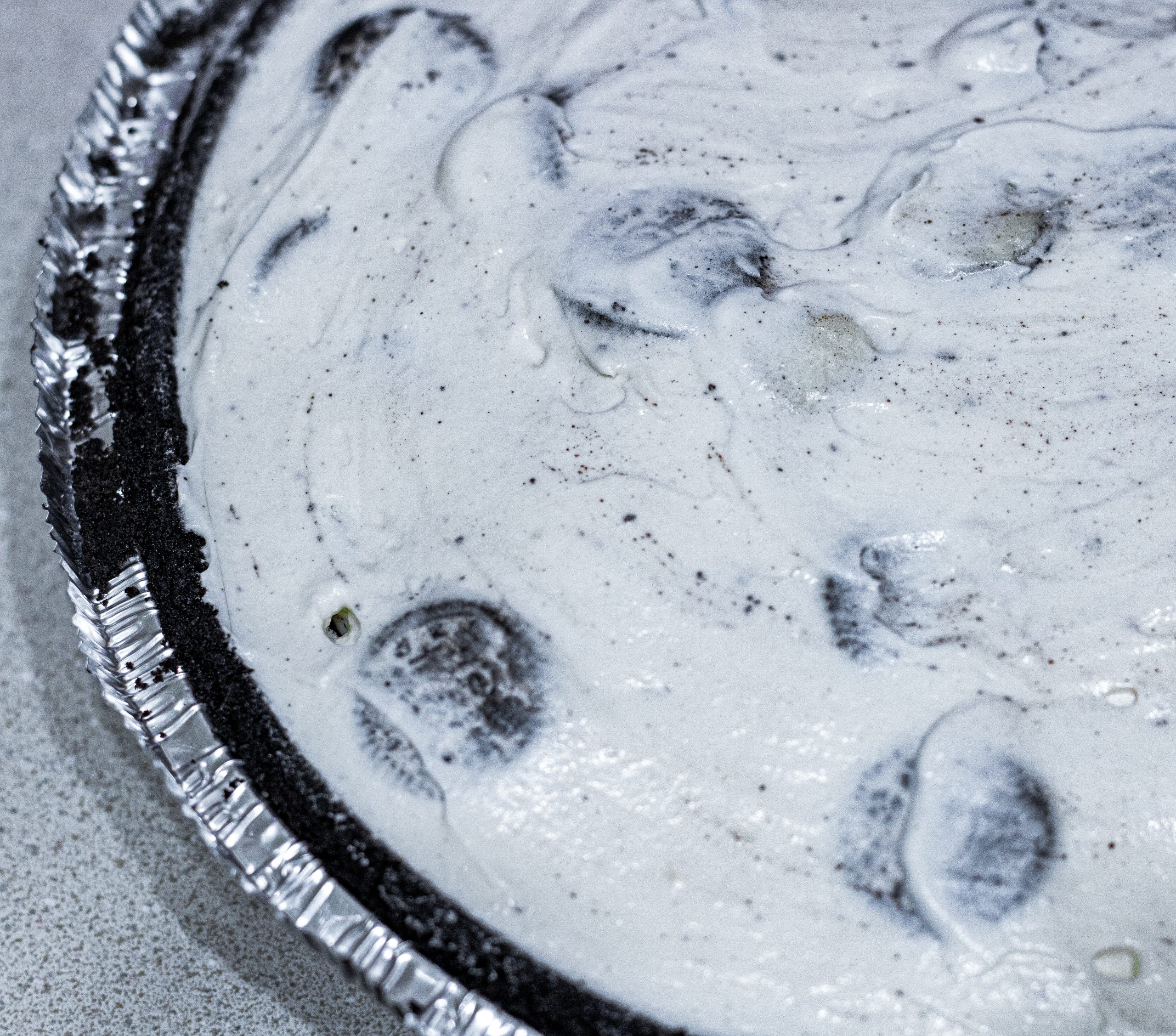 Pour mixture into the Oreo pie crust, making sure not to overfill.