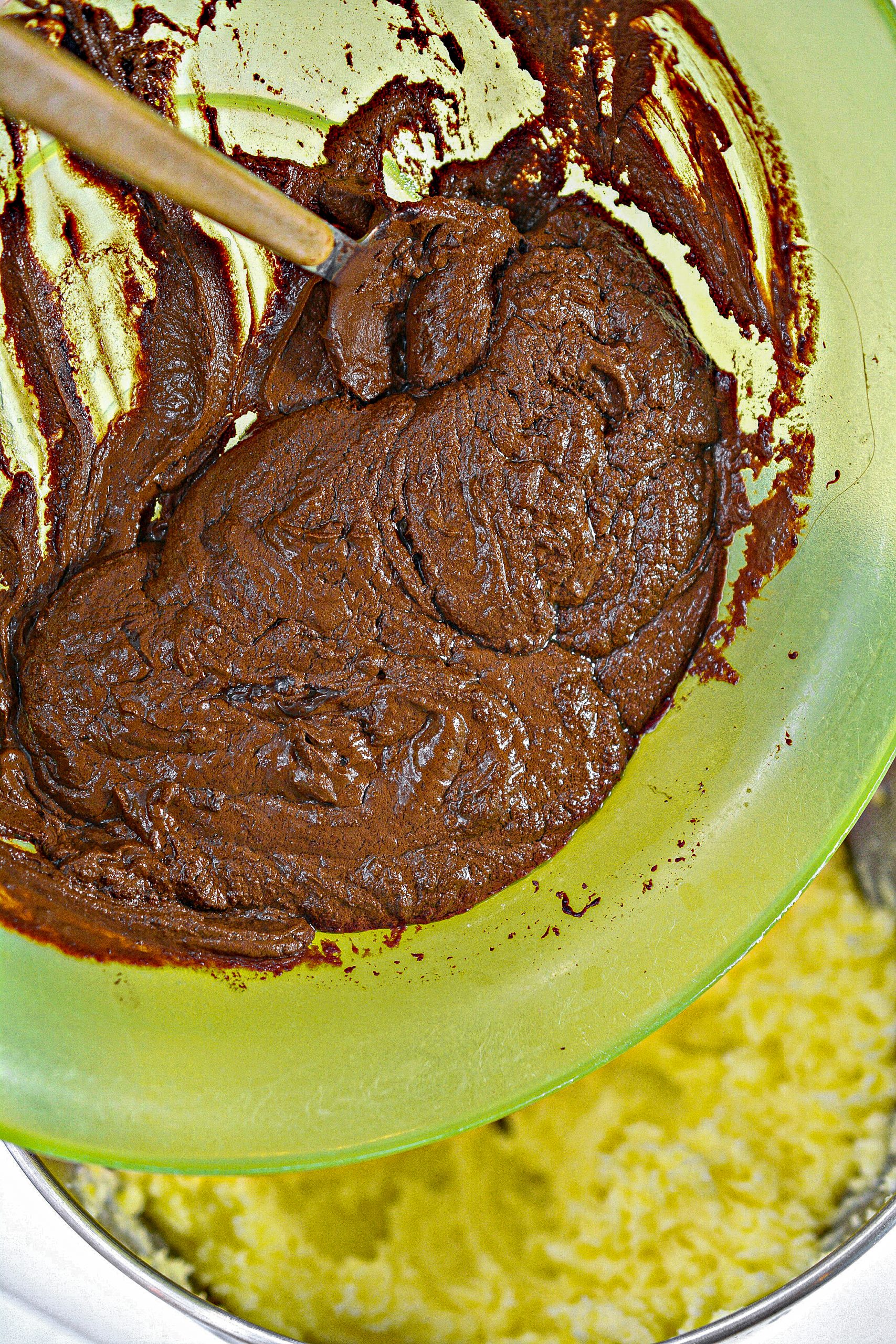 Mix the chocolate and vanilla into the butter and sugar mixture.
