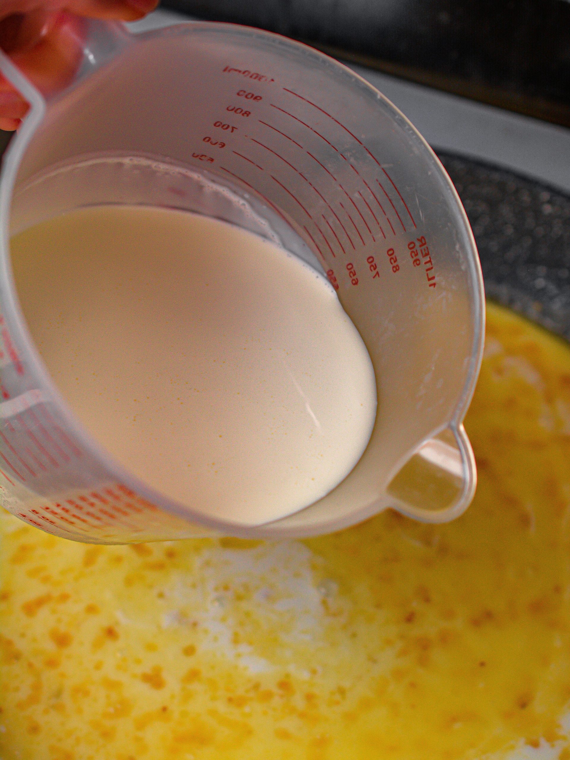 Pour in the milk and heavy whipping cream as well as salt and pepper to taste. 