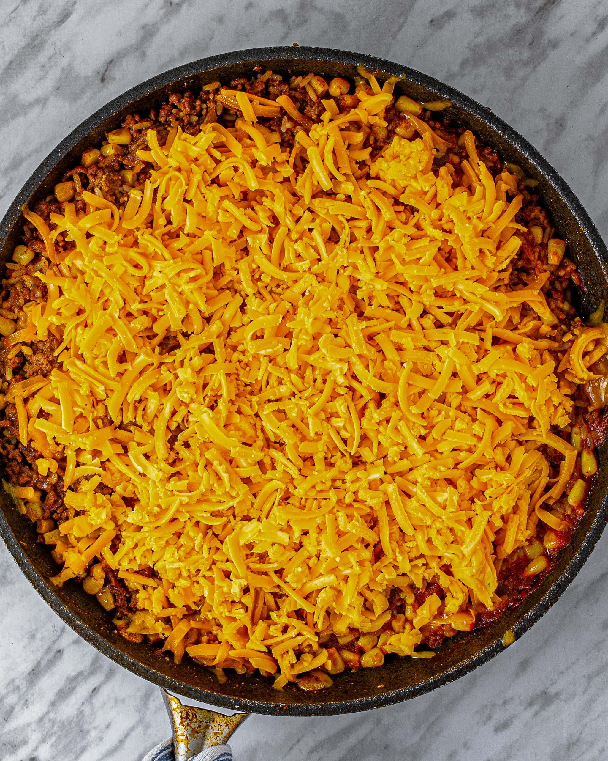 Sprinkle the cheese on top and cover again.