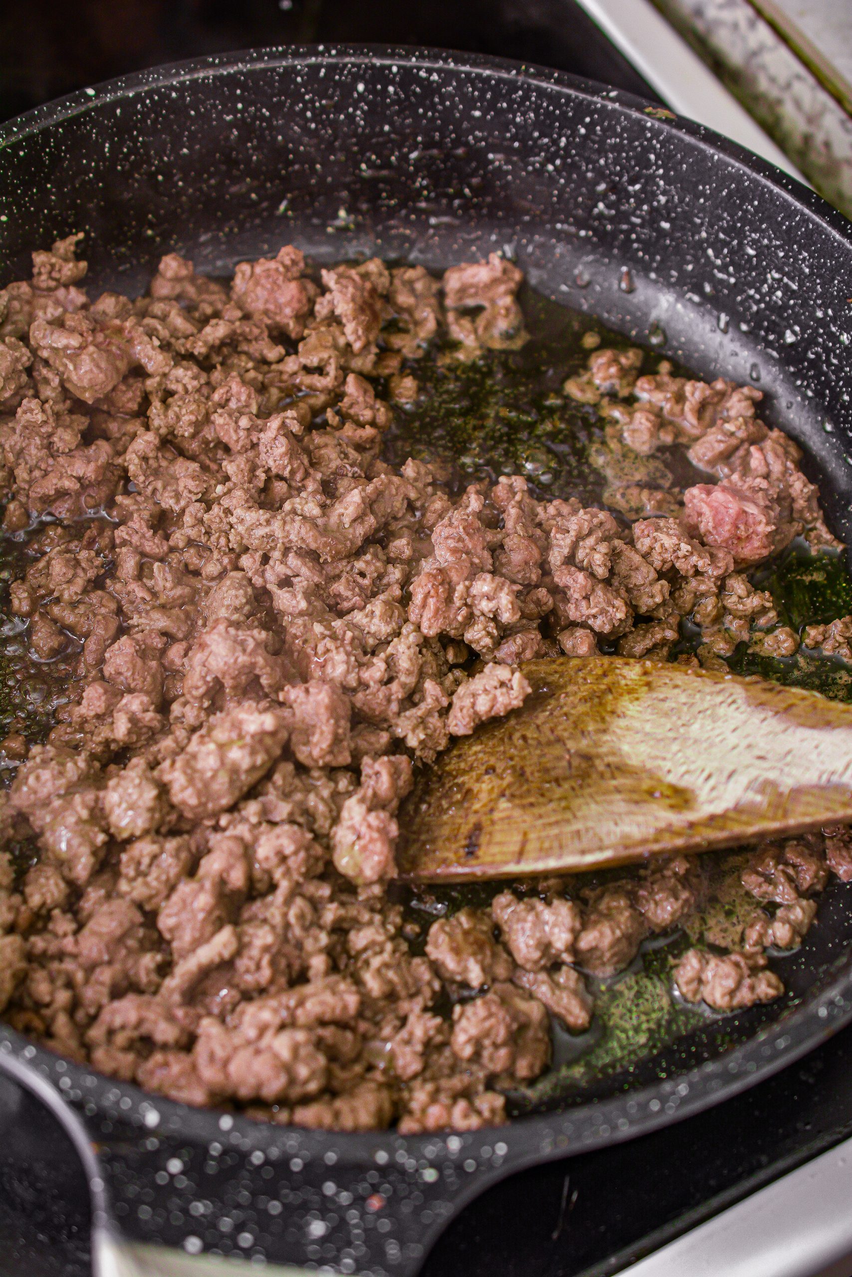 Add the ground beef to a skillet over medium-high heat on the stove, and cook until completely browned