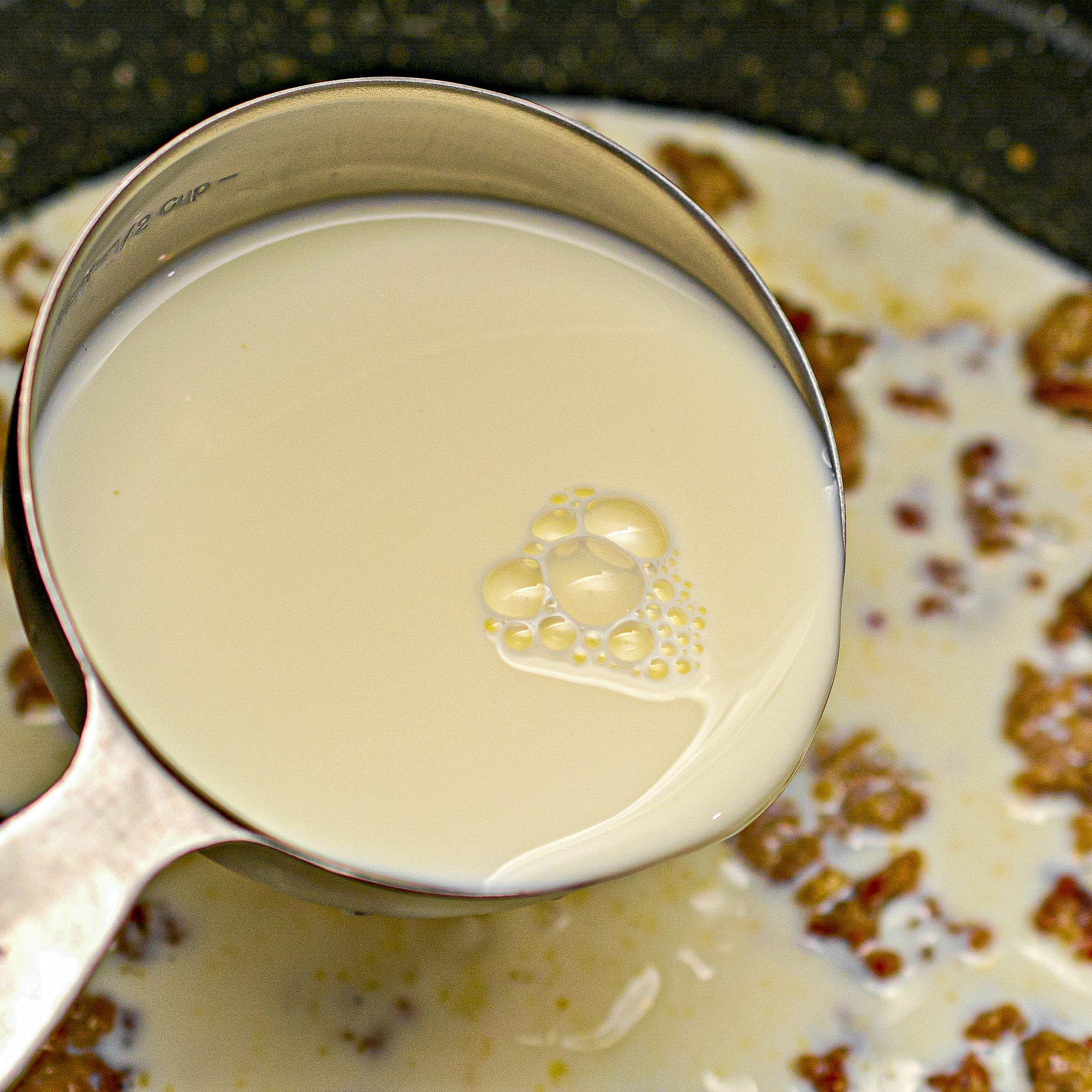 Whisk in the whole milk, and continue to cook until the gravy has thickened.