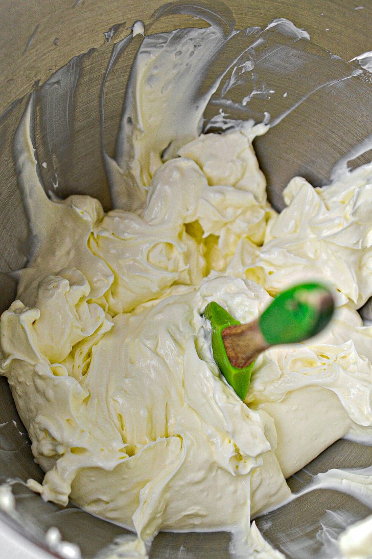 Mix together 8 oz of sour cream and 8 oz of cream cheese in a bowl.