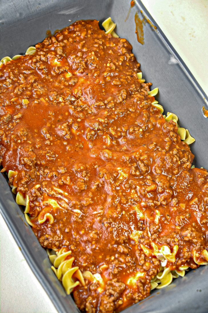 Repeat with another layer of noodles, cream cheese mixture, and then ground beef on top.