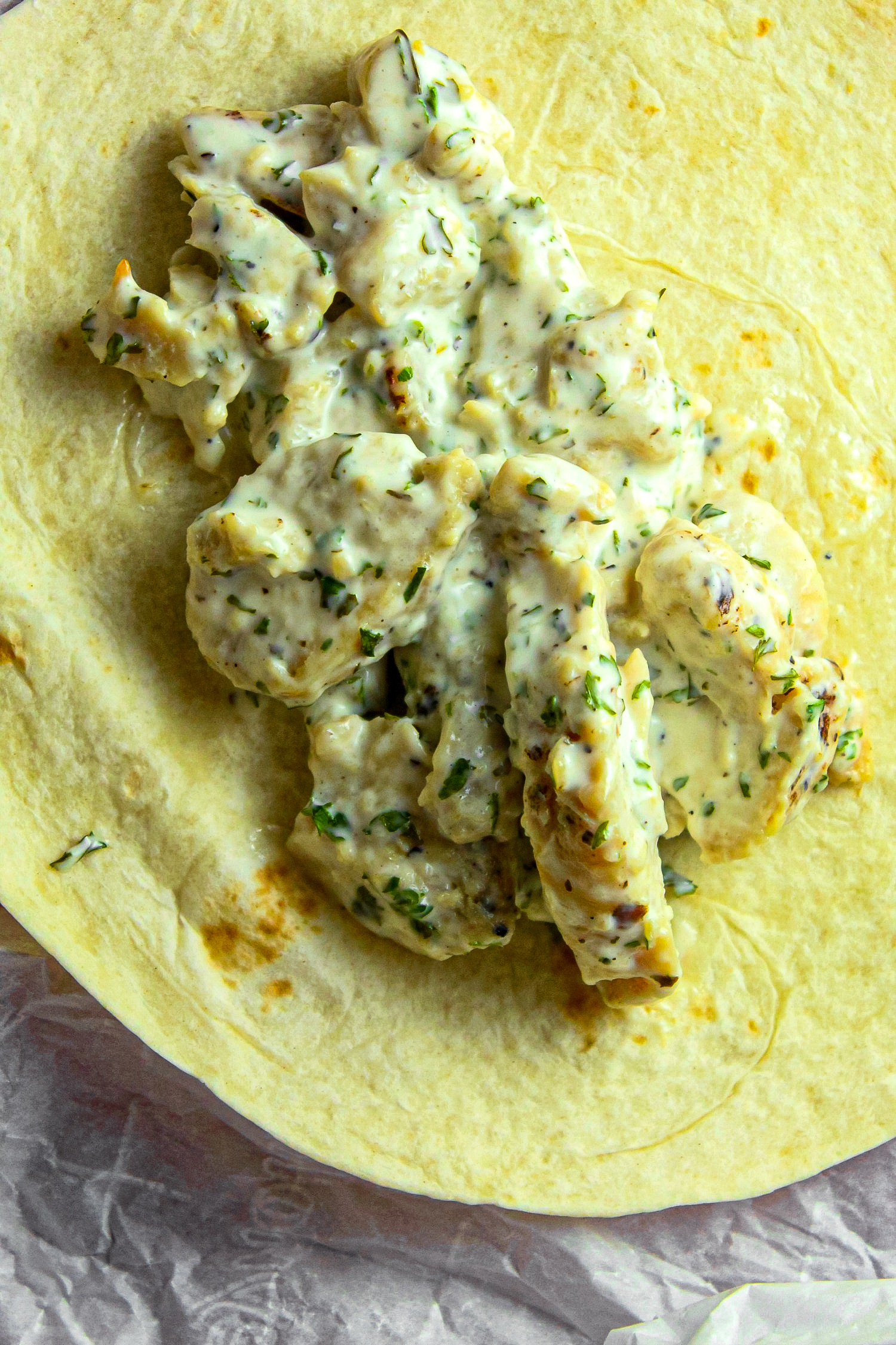 Lay chicken on tortilla, top with cheese and cover with ranch dressing.