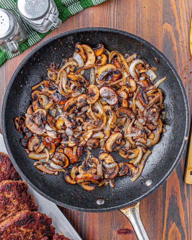 Cook the onion-mushroom mixture until golden brown.