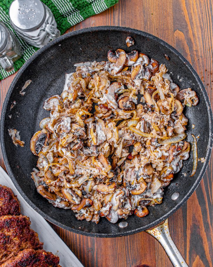 Add the flour into the skillet with the mushrooms and onions, and stir until there are no more lumps of flour.