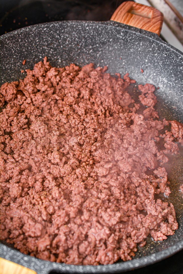 Brown the ground beef in a skillet over medium-high heat on the stove.