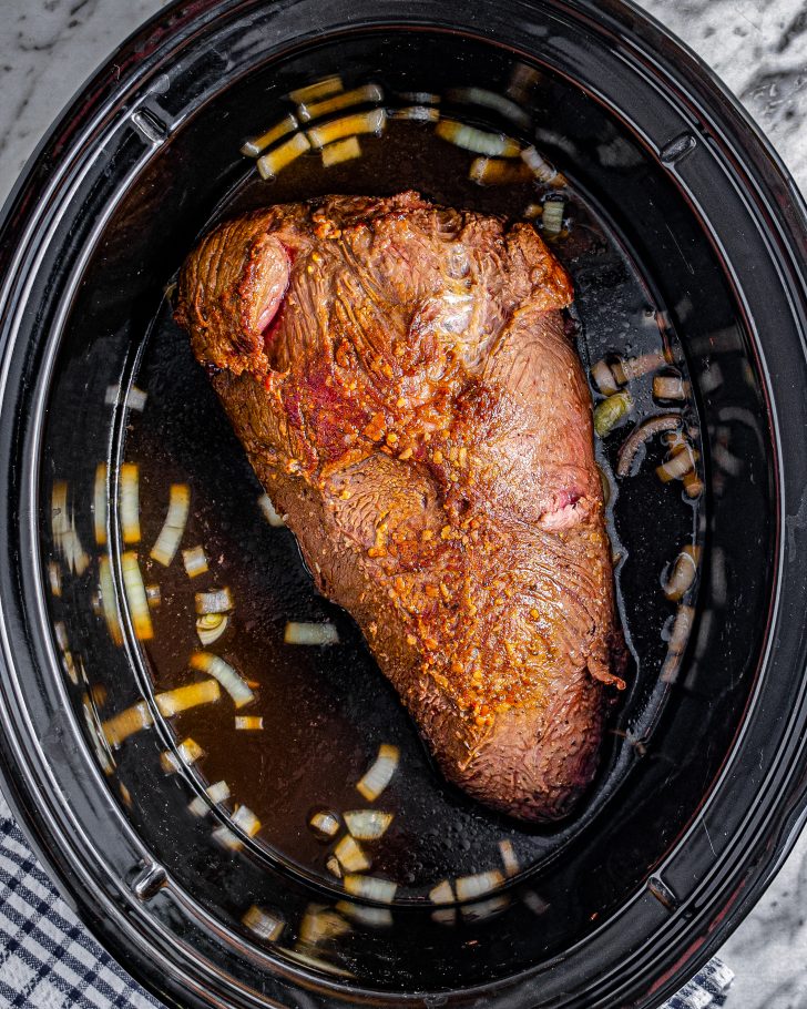 Place the meat into the slow cooker and cook on high for 6 hours.