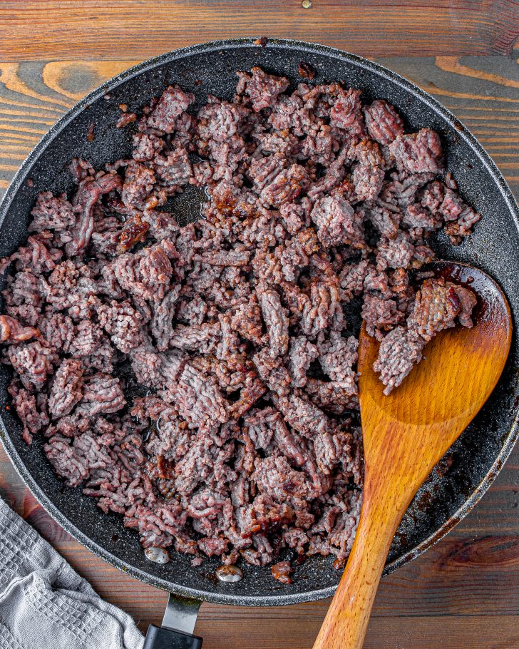 Brown the ground beef in a skillet over medium-high heat, and drain the excess fat.