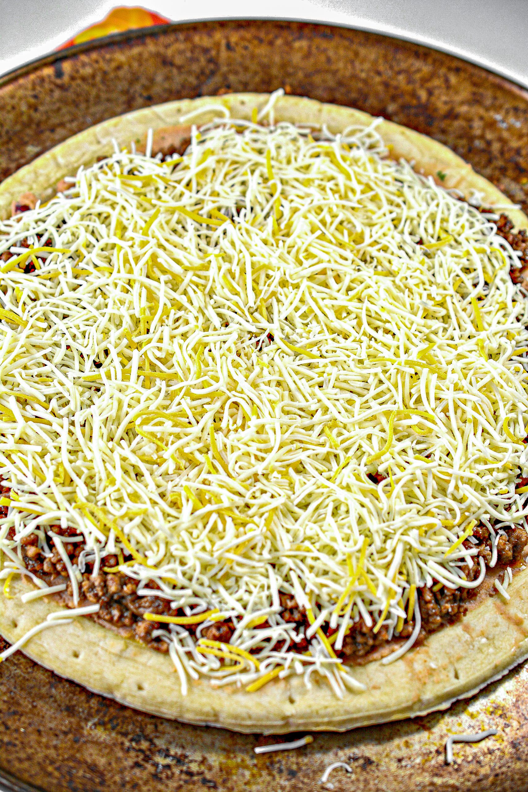 Sprinkle the cheese on top, and bake for 10-12 minutes until the cheese is completely melted.