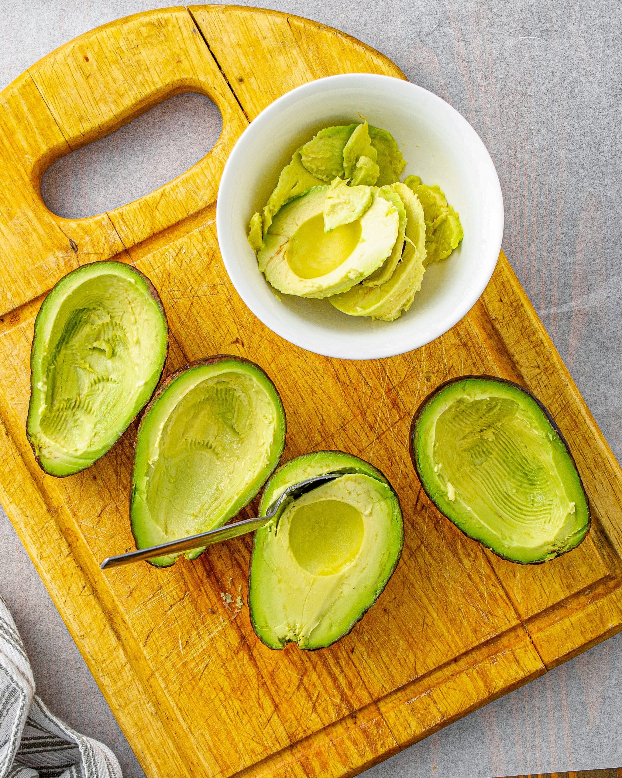 Scoop out the flesh from the inside of the avocados.